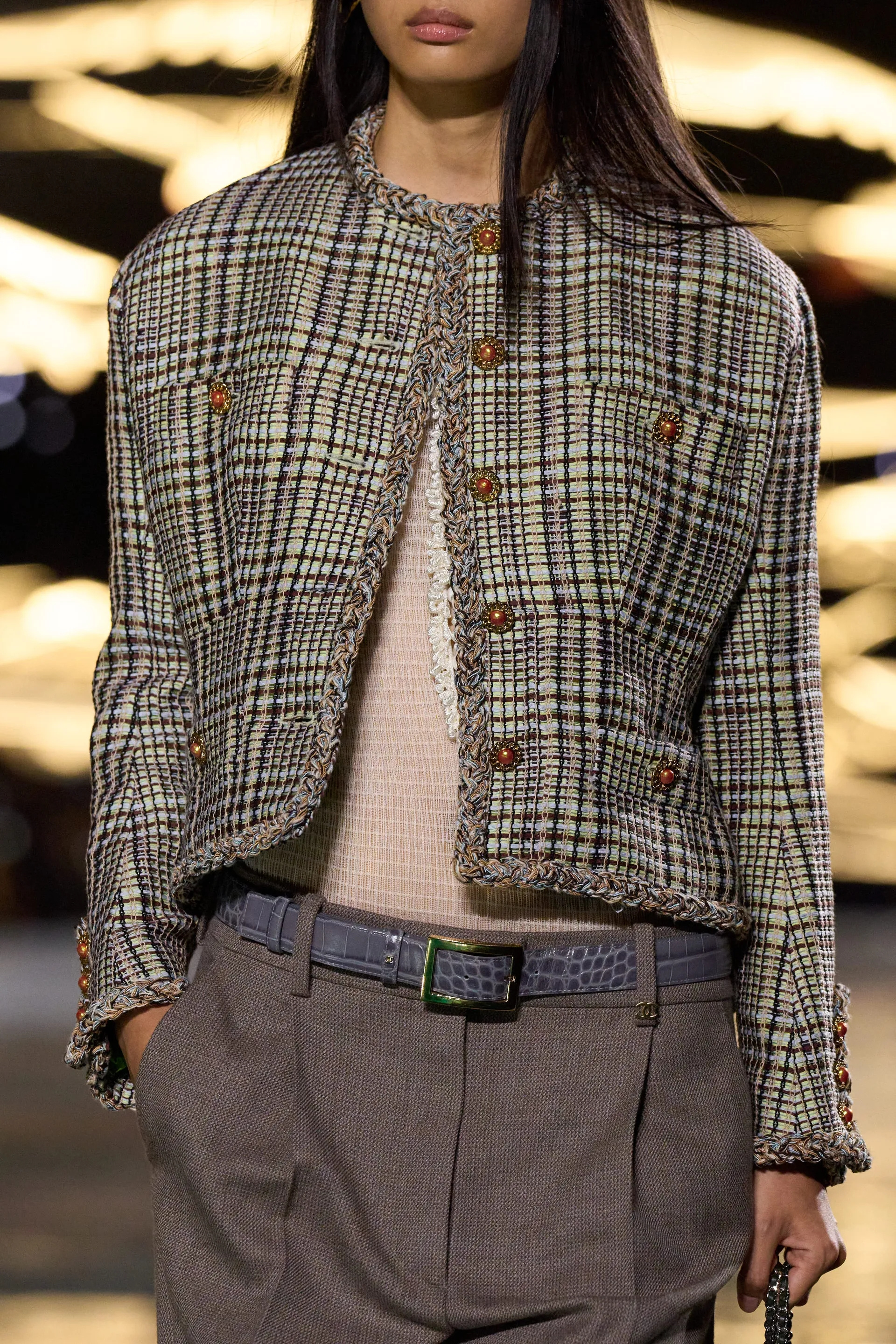 A model walks the runway at the Chanel Details