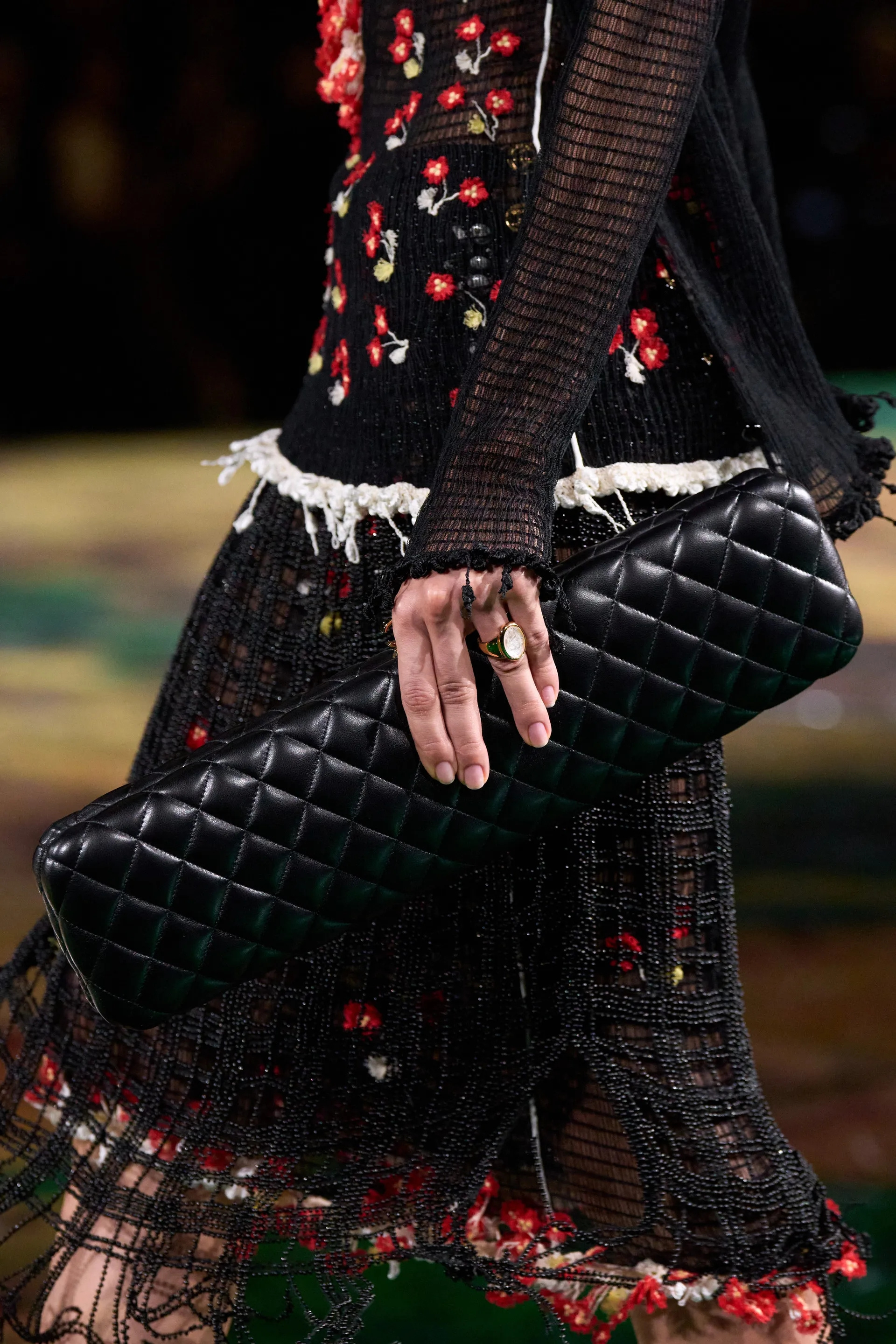 A model walks the runway at the Chanel Details show