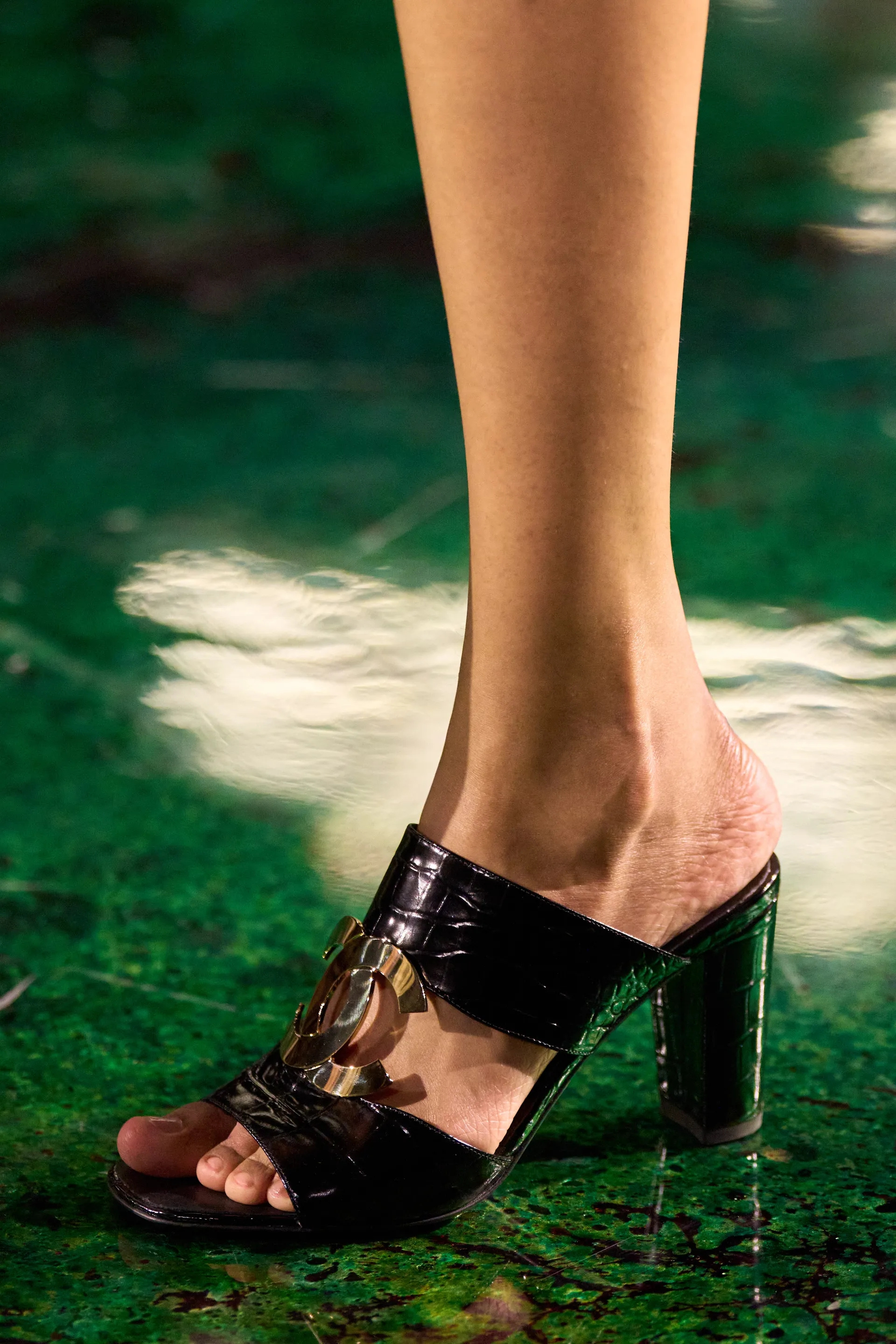 A model walks the runway at the Chanel Details show