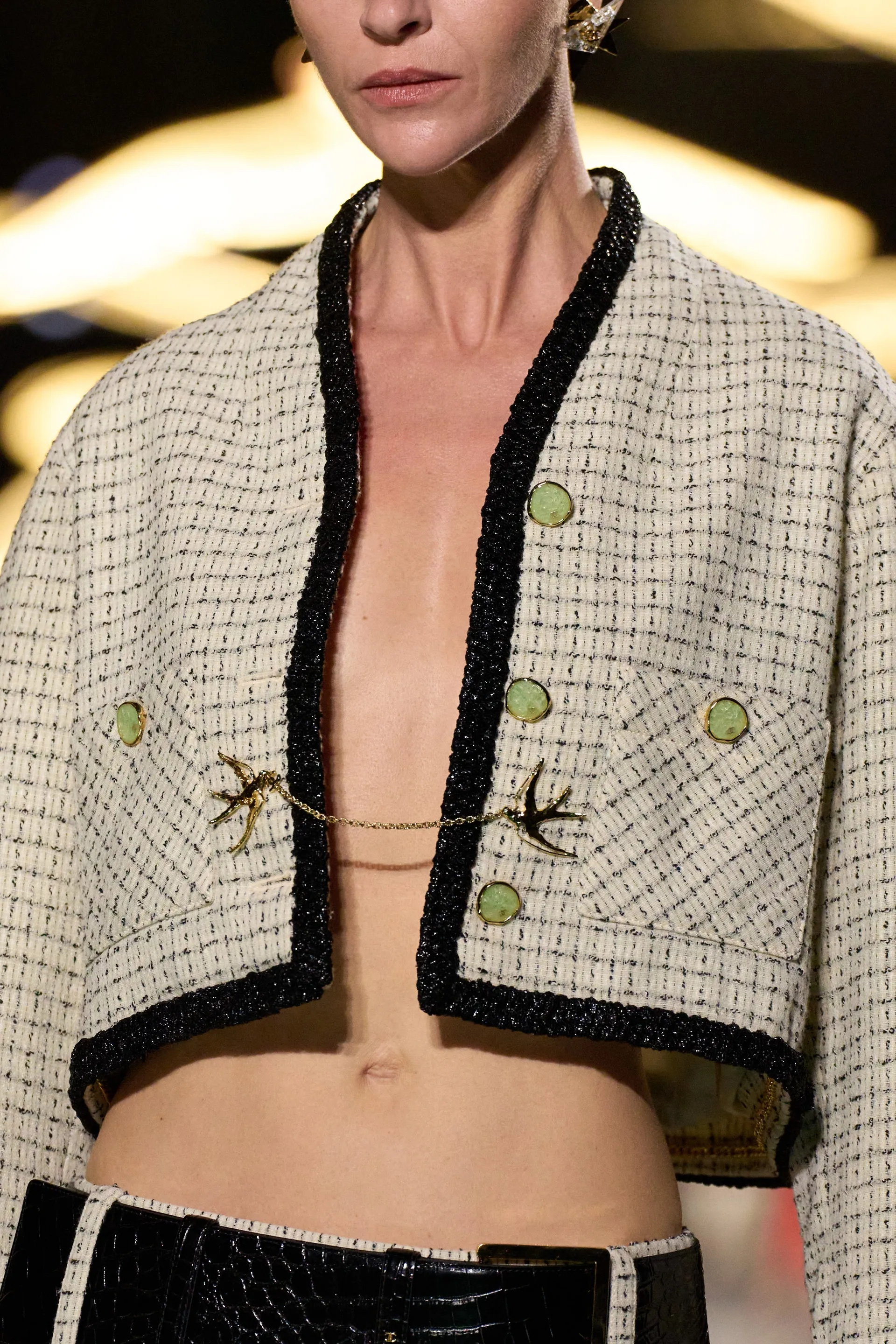 A model walks the runway at the Chanel Details show