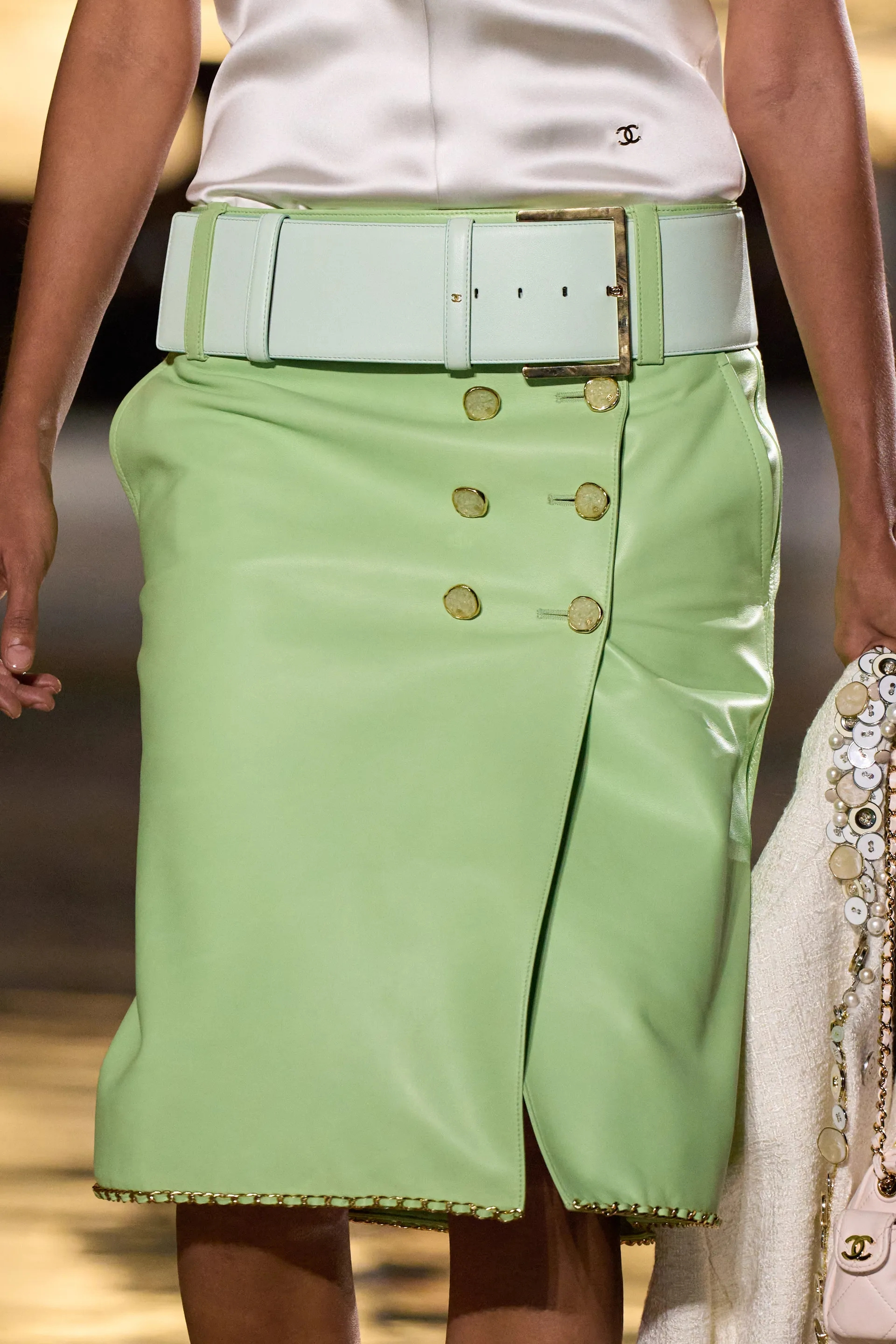 A model walks the runway at the Chanel Details show
