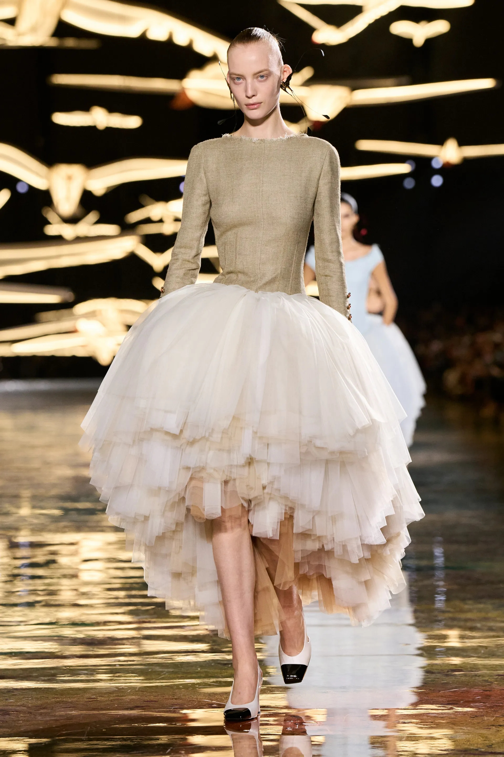 A model walks the runway at the Chanel show