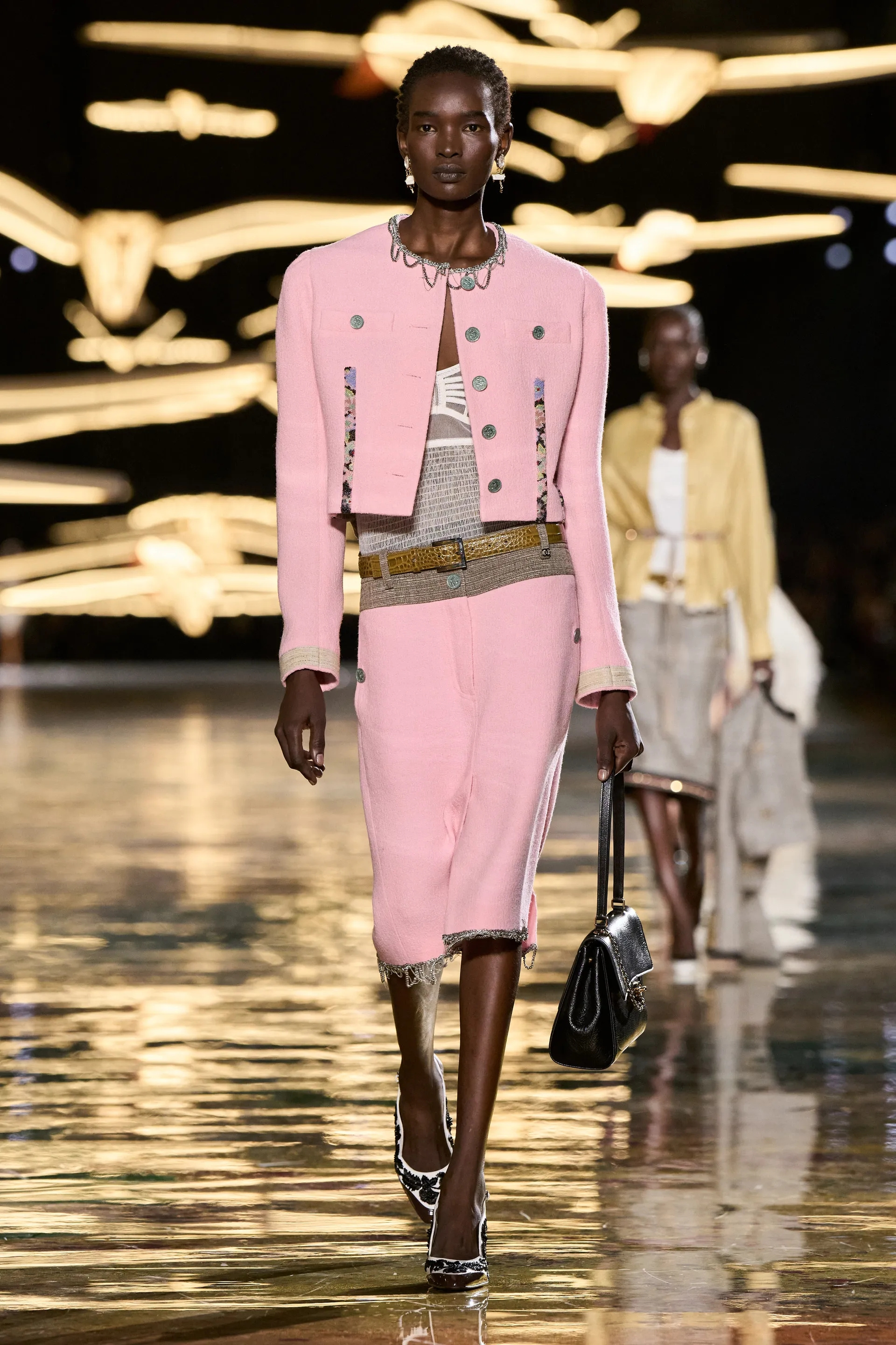A model walks the runway at the Chanel Details