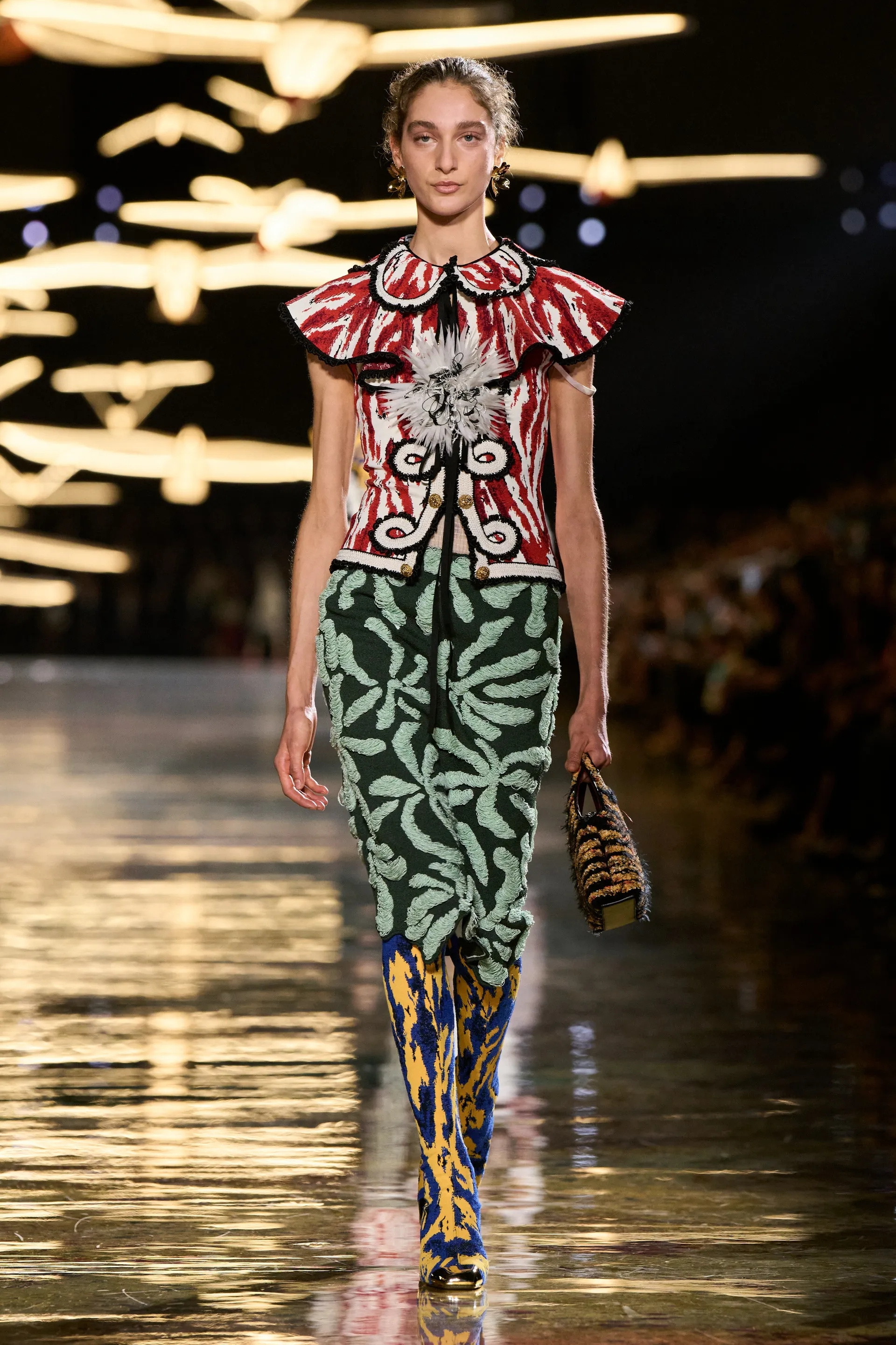 A model walks the runway at the Chanel Details show