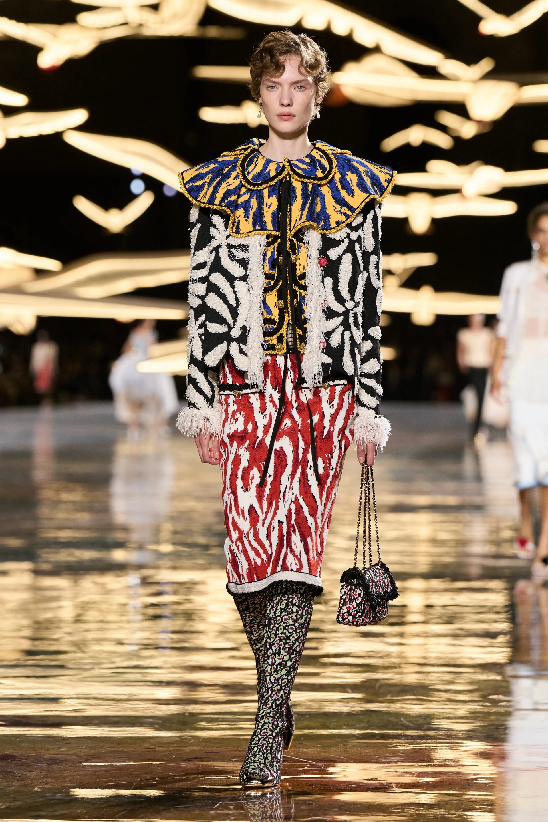 A model walks the runway at the Chanel Details show
