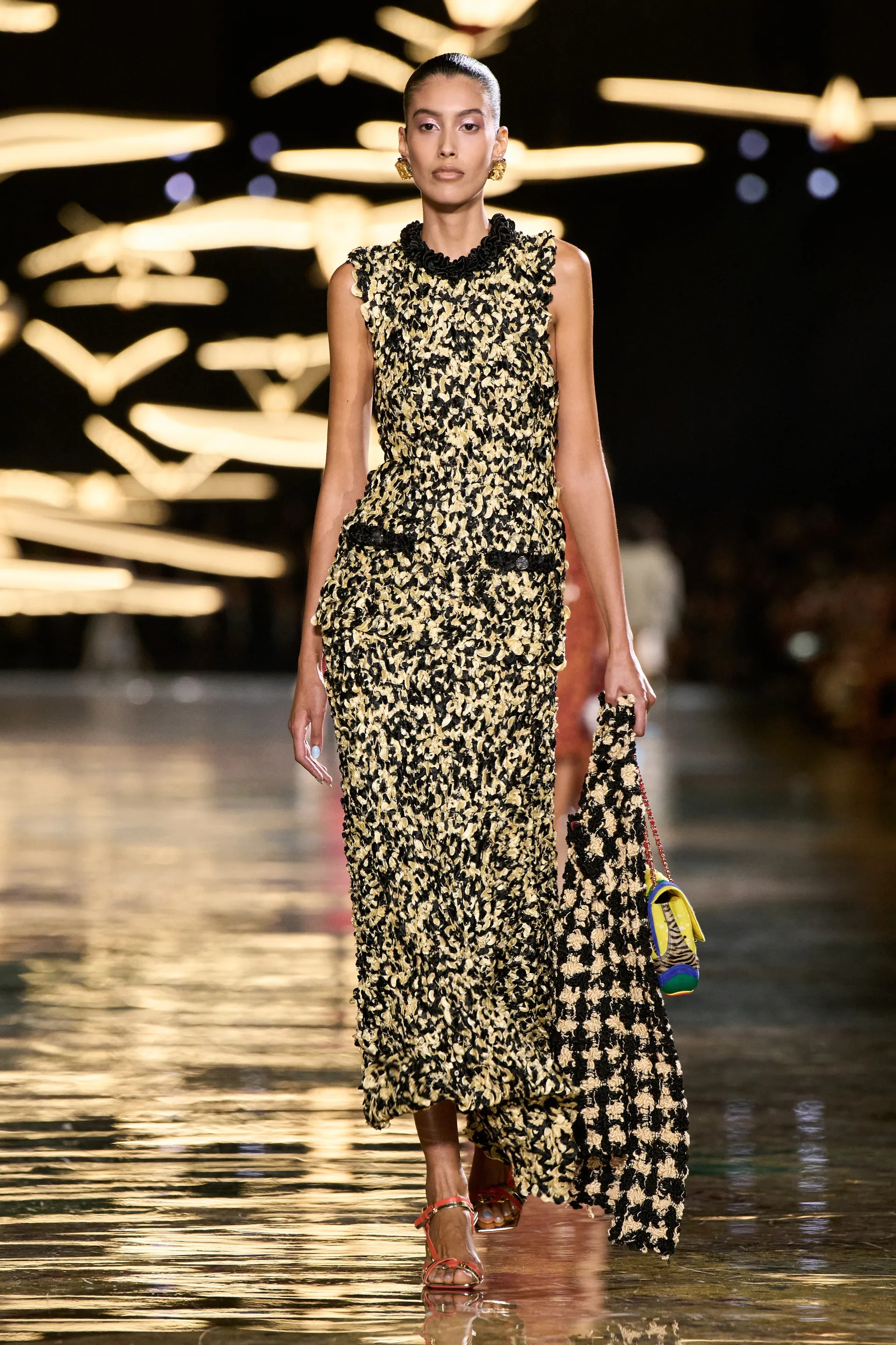 A model walks the runway at the Chanel show