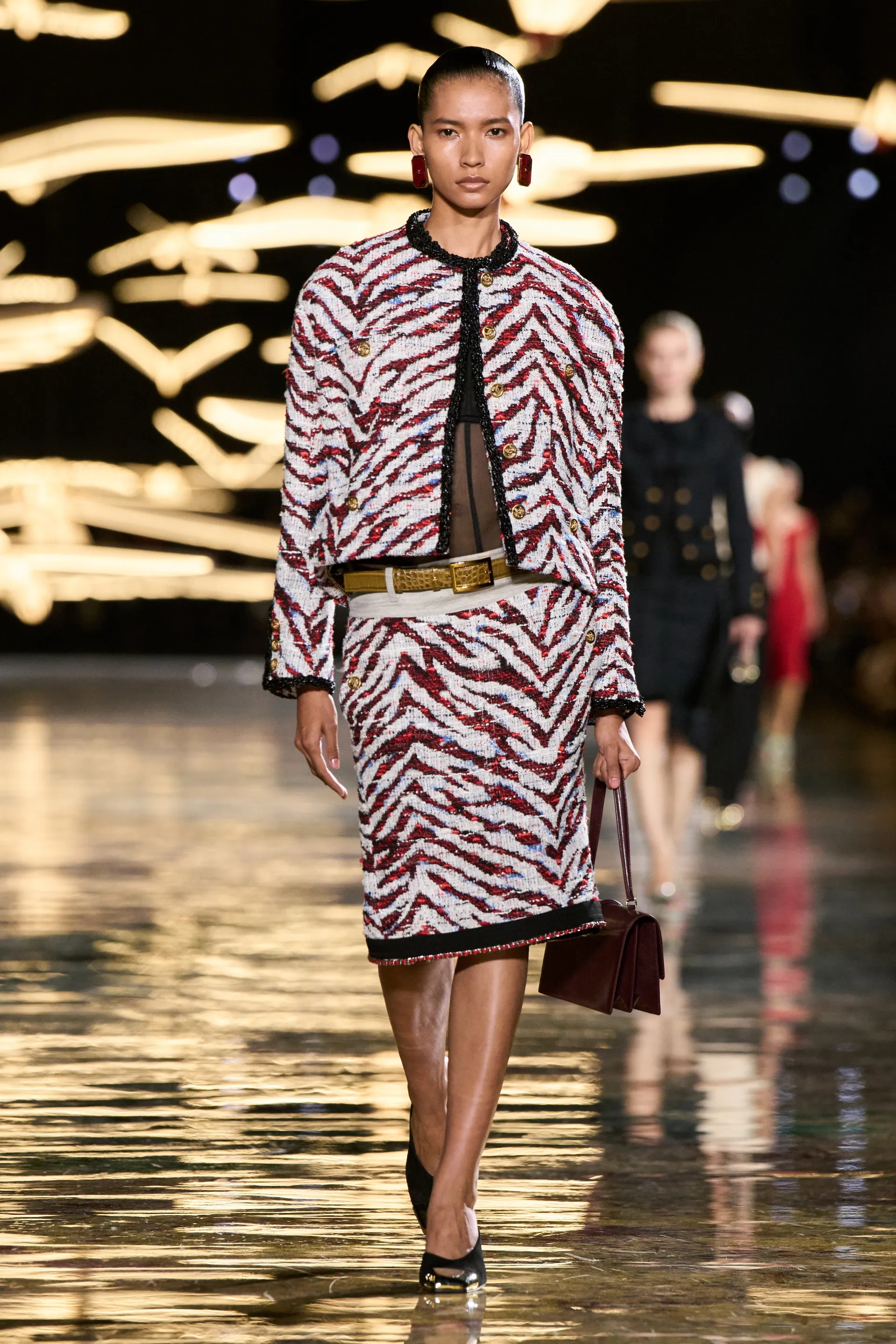 A model walks the runway at the Chanel show
