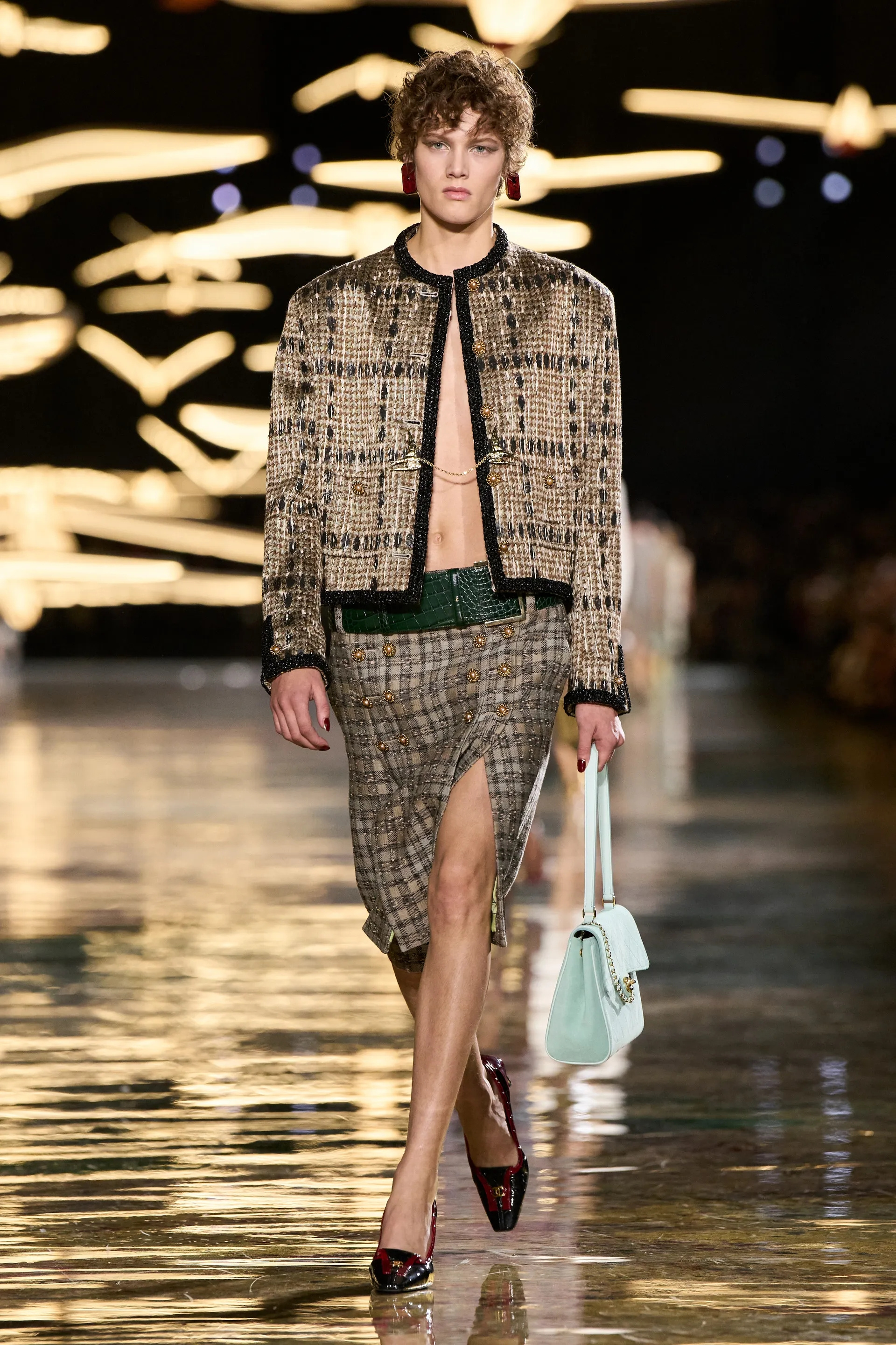A model walks the runway at the Chanel Details show