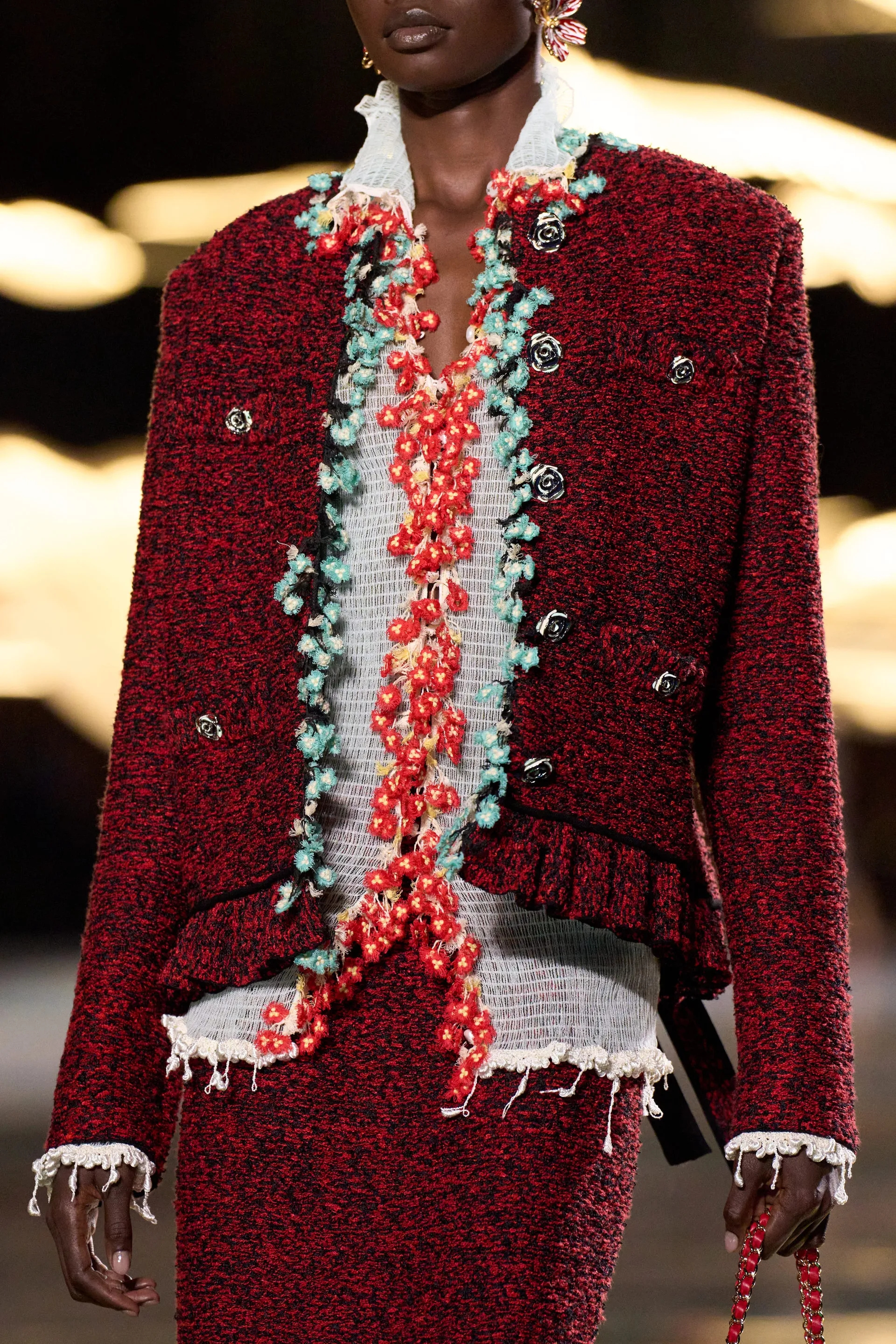 A model walks the runway at the Chanel Details show