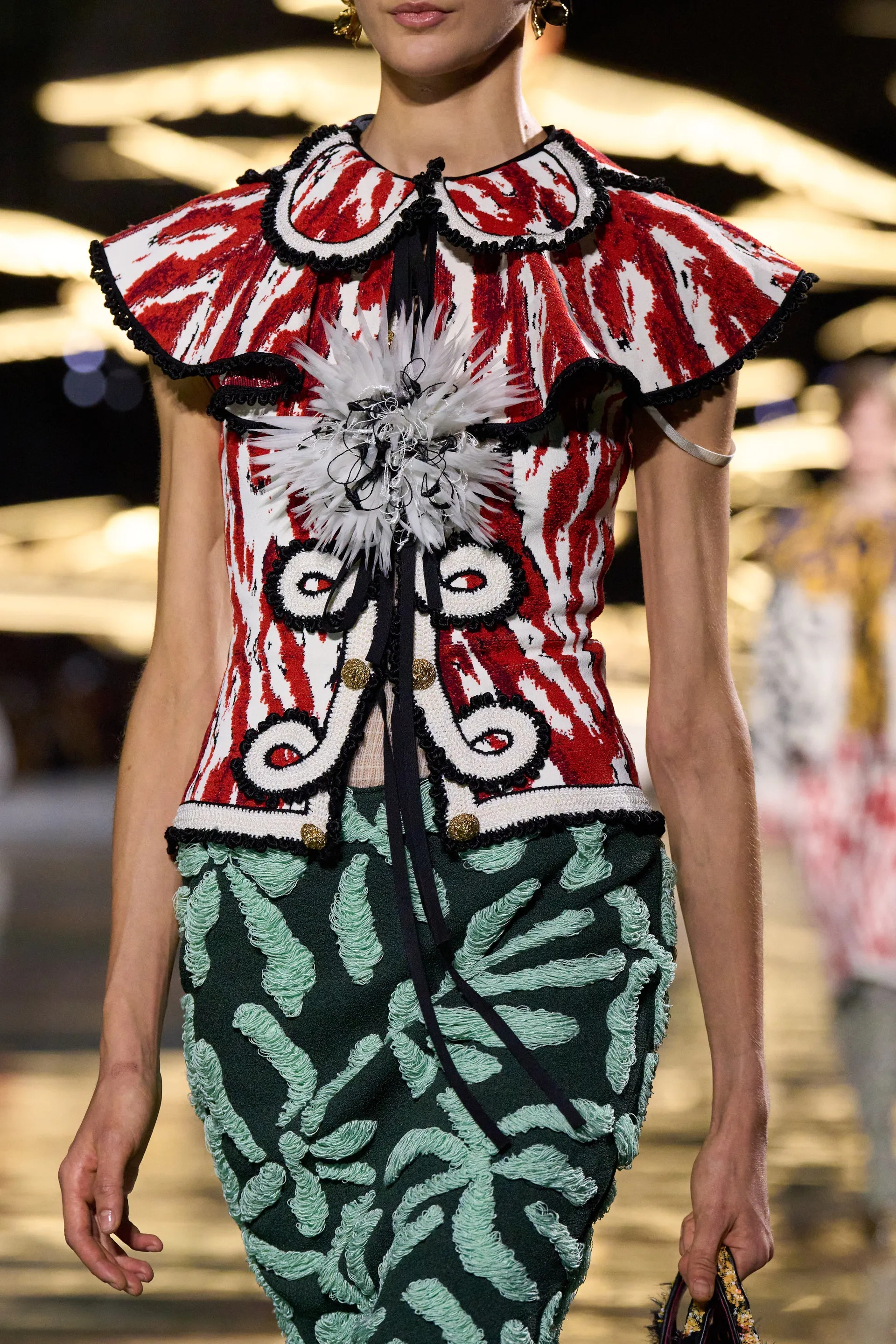 A model walks the runway at the Chanel Details show
