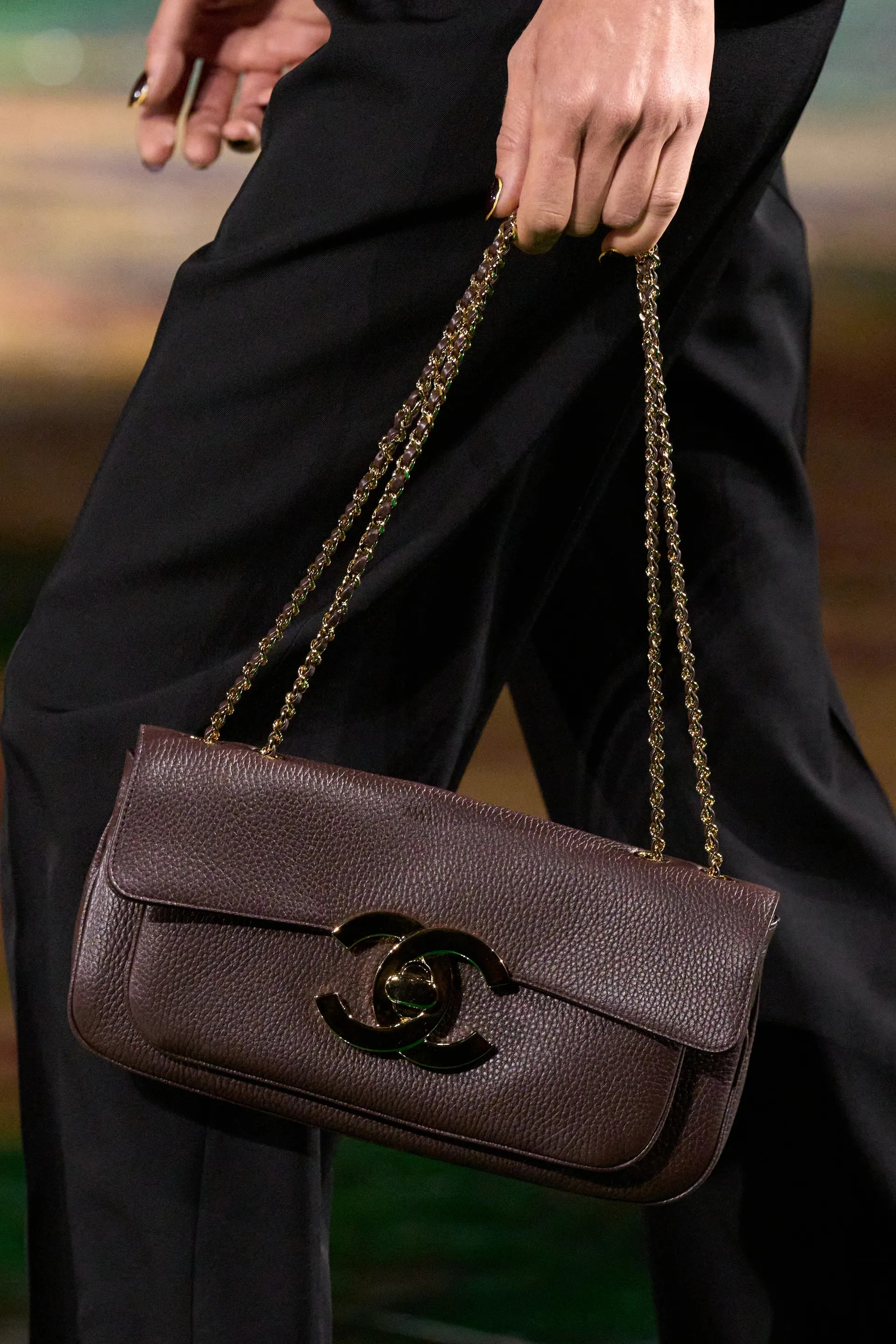 A model walks the runway at the Chanel Details show