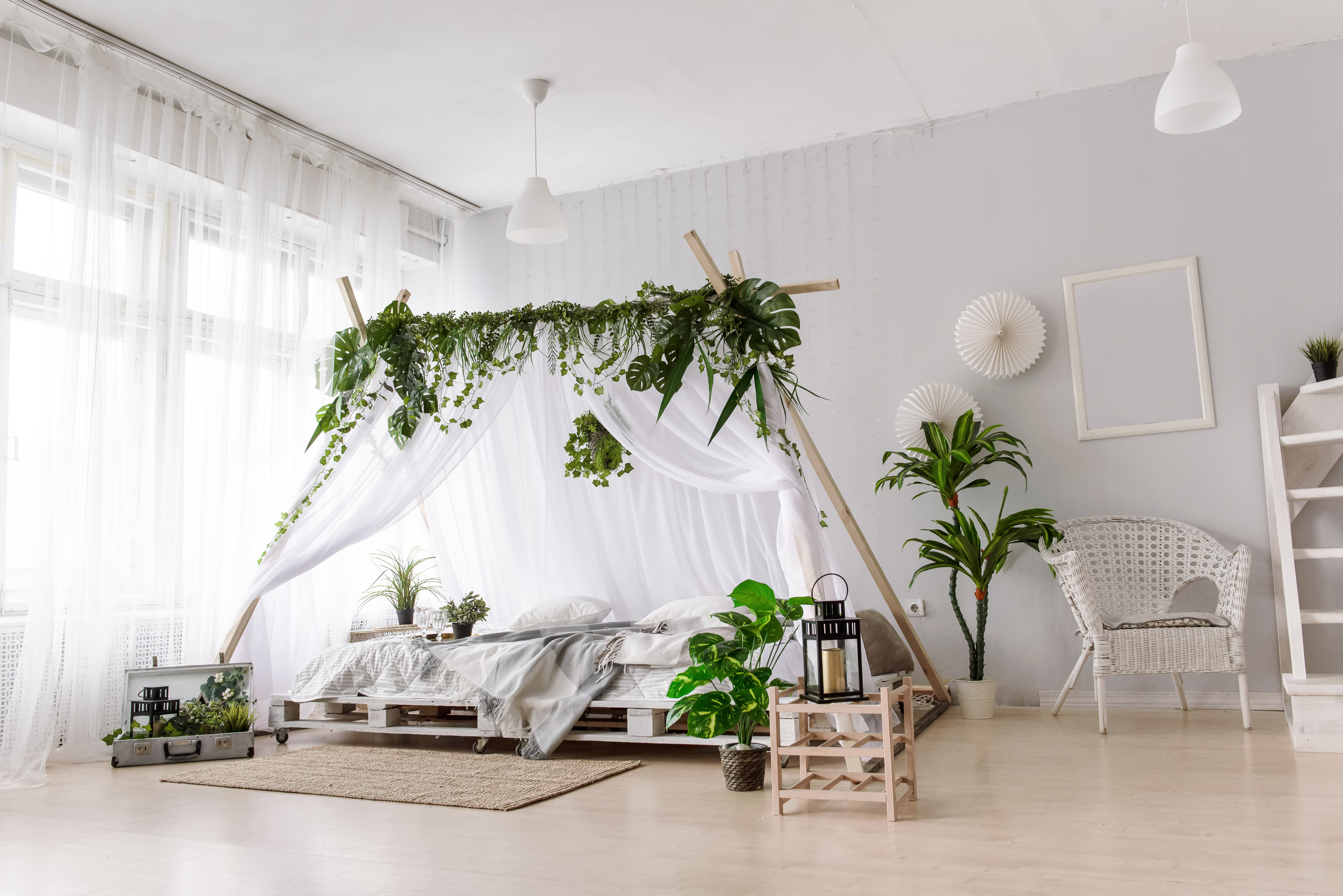 A,Bed,With,A,White,Canopy,In,A,Bright,Bedroom.