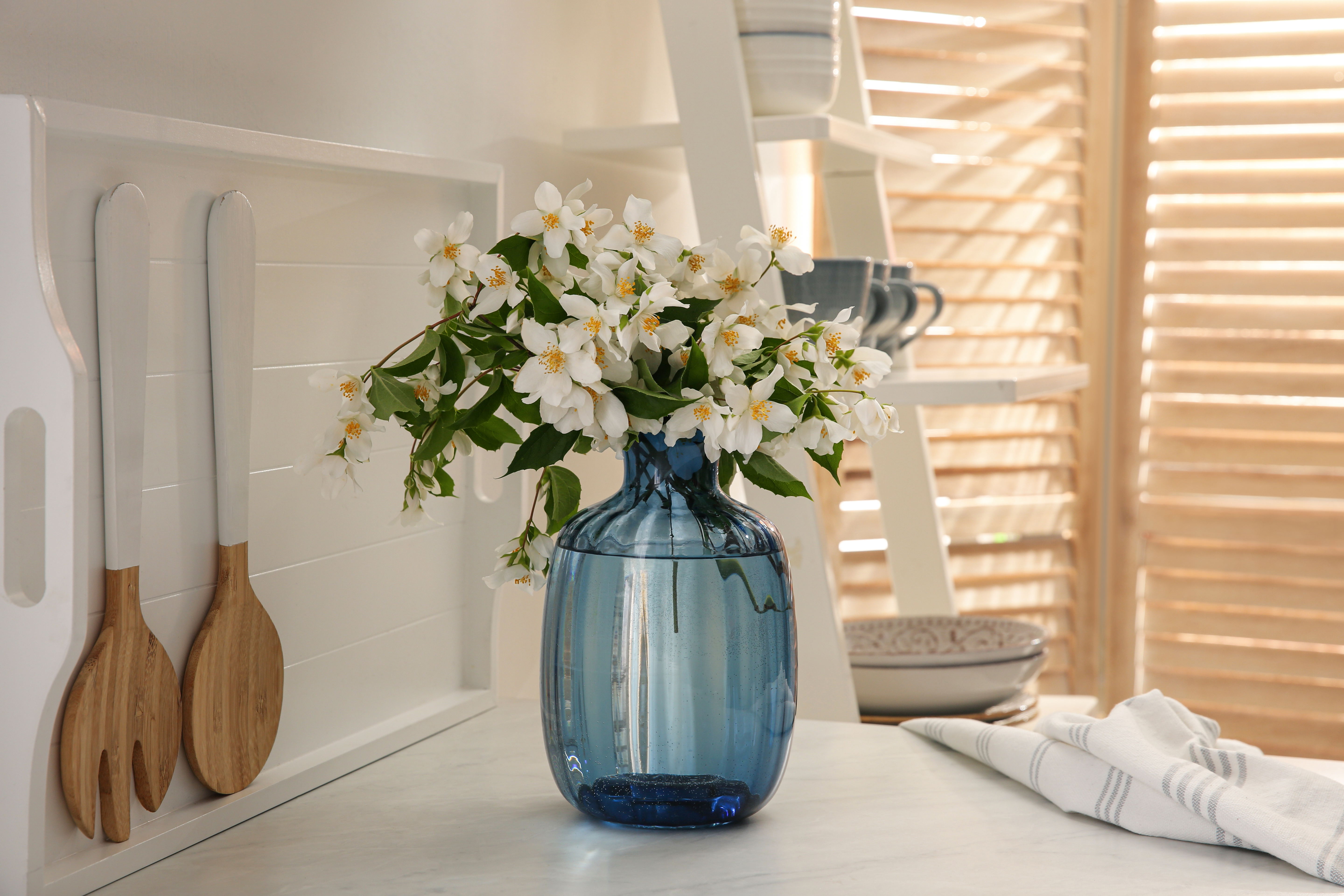 Bouquet,Of,Beautiful,Jasmine,Flowers,On,Countertop,In,Kitchen