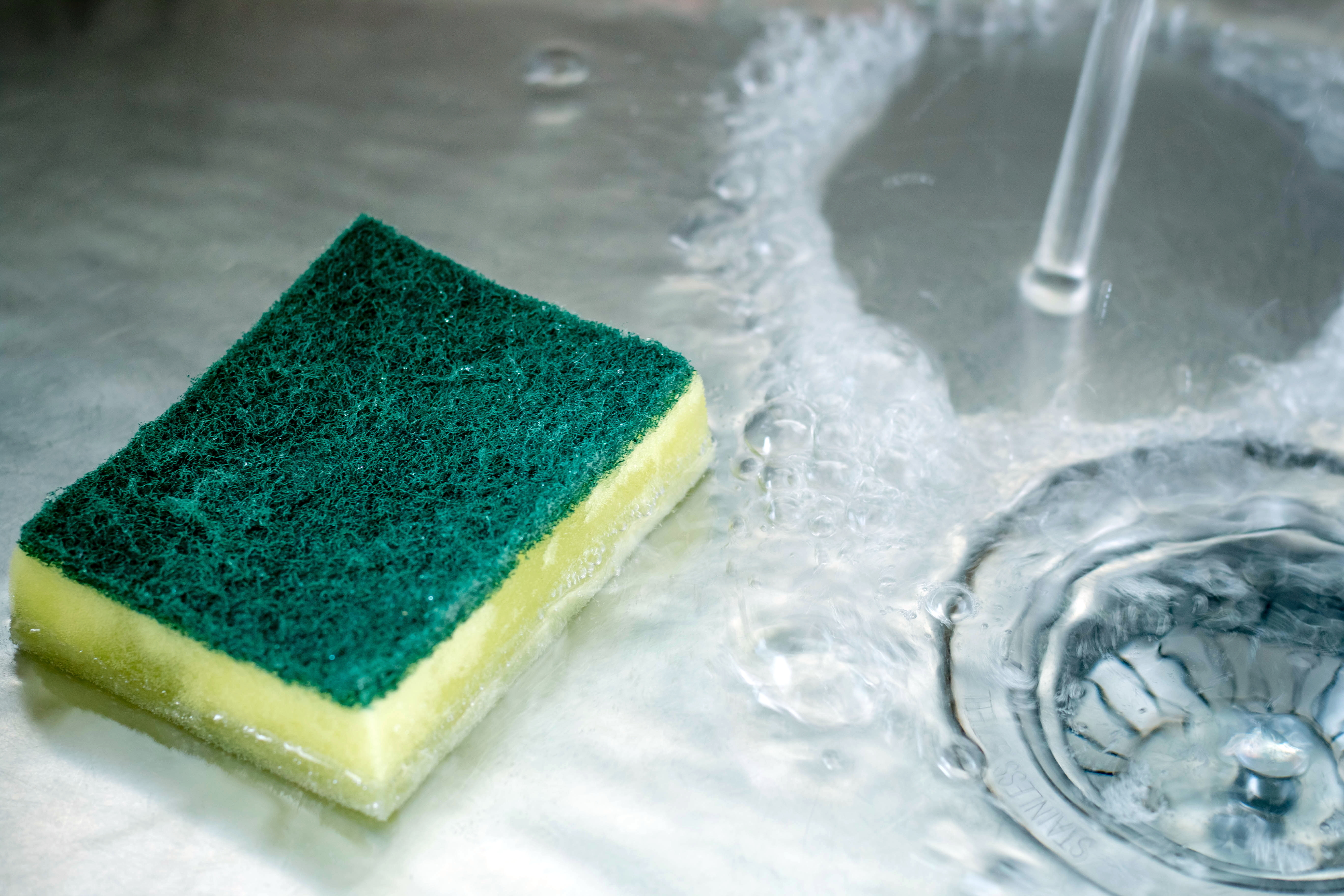 Dishwashing,Sponge,In,Old,Sink,And,Open,Water.,Save,The
