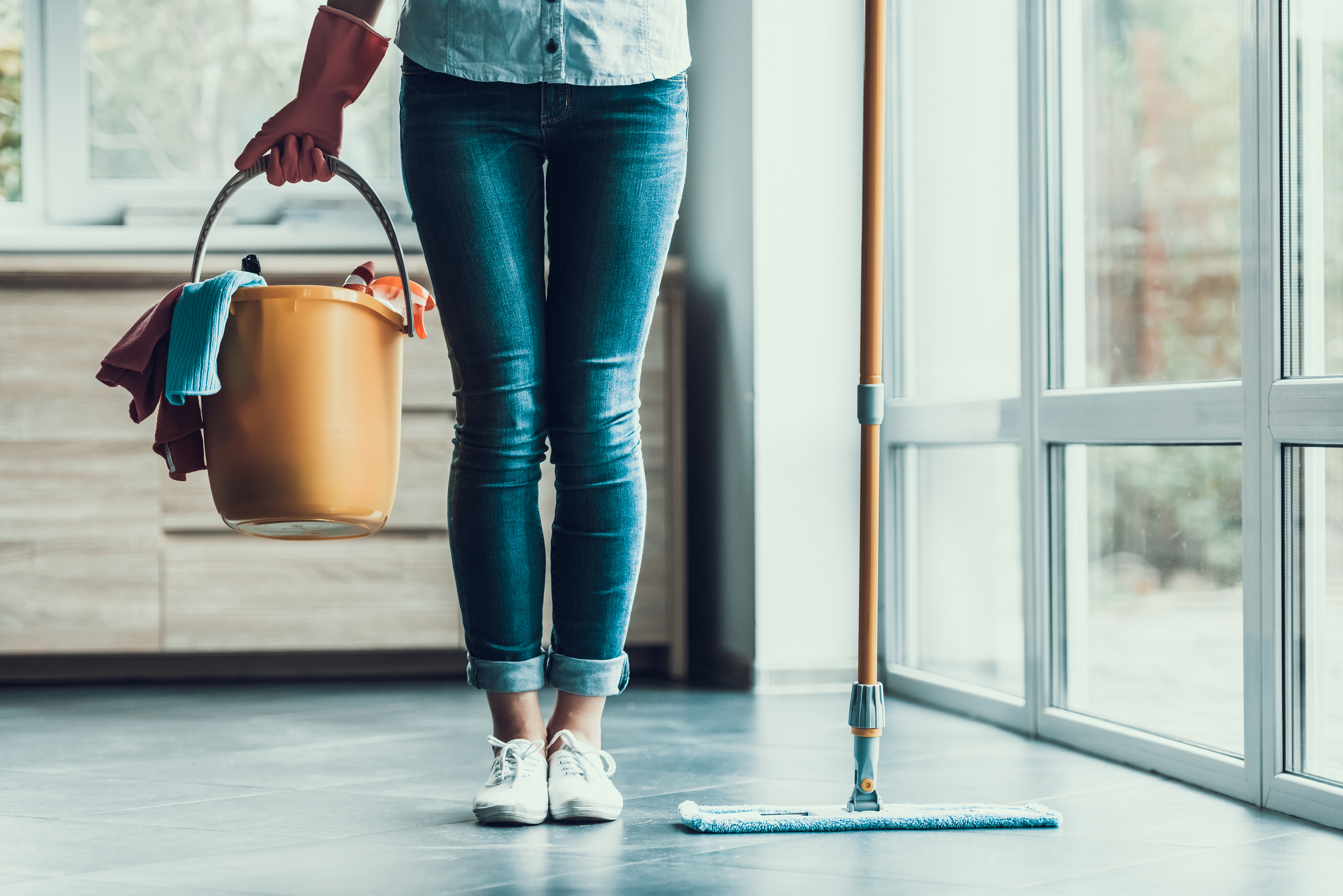 Young,Woman,Holds,Bucket,With,Cleaning,Equipment.,Closeup,Of,Beautifull