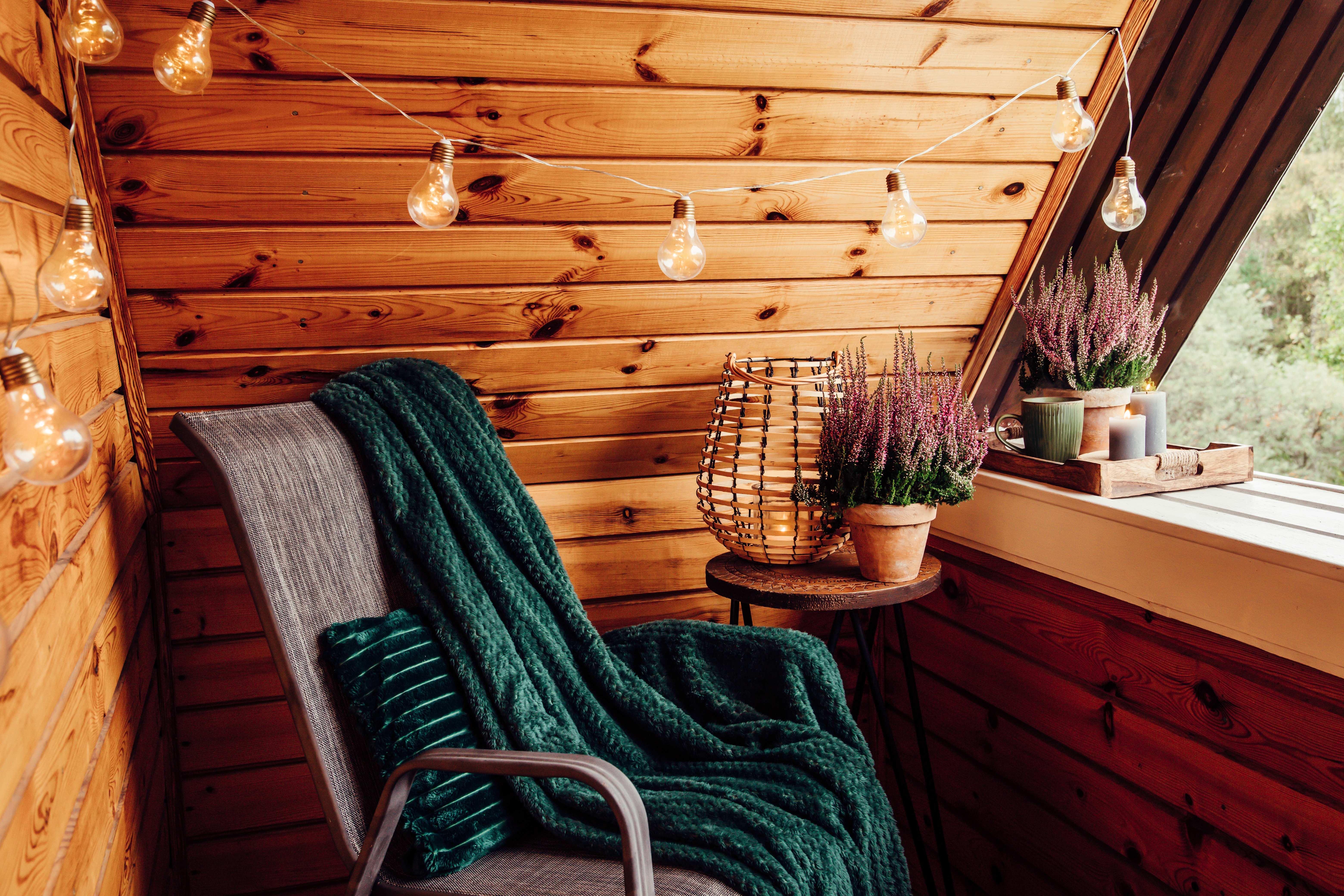 Small,Natural,Color,Wooden,Cabin,Balcony,With,Heather,Flowers,,Candlelight