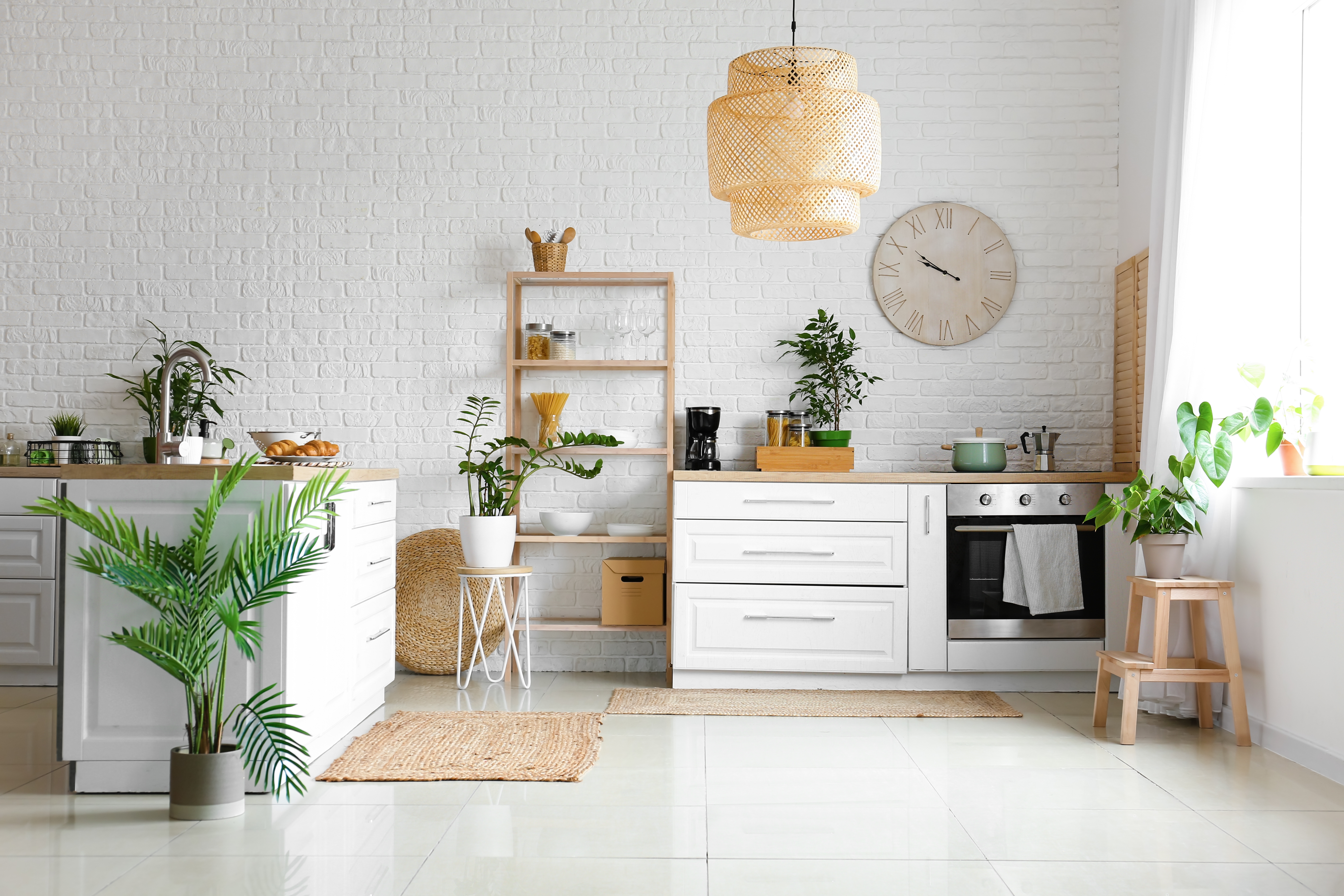 Interior,Of,Modern,Kitchen,With,Counters,,Houseplants,And,Clock