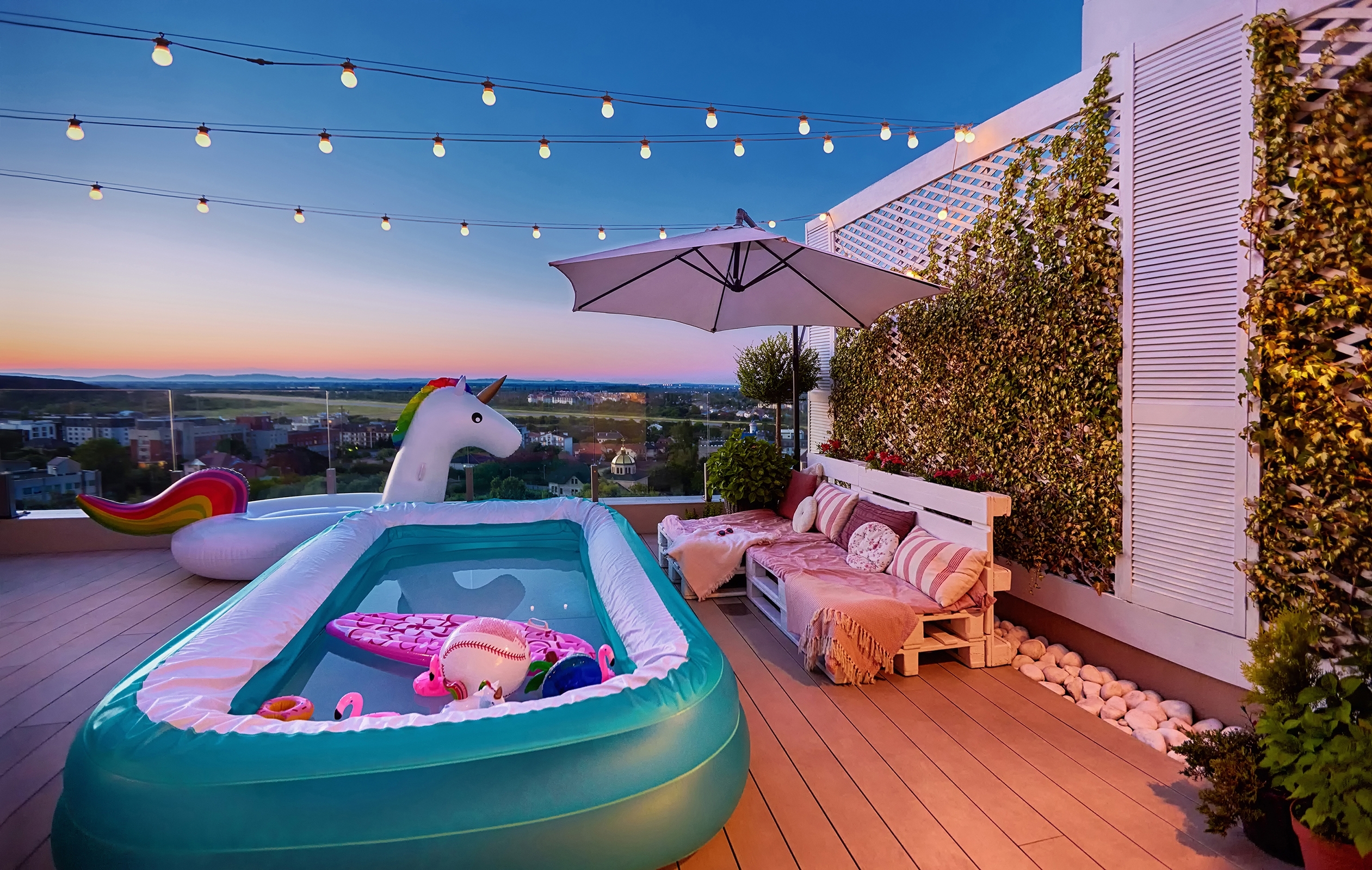 Cozy,Rooftop,Patio,With,Wooden,Pallet,Furniture,,Vertical,Garden,And