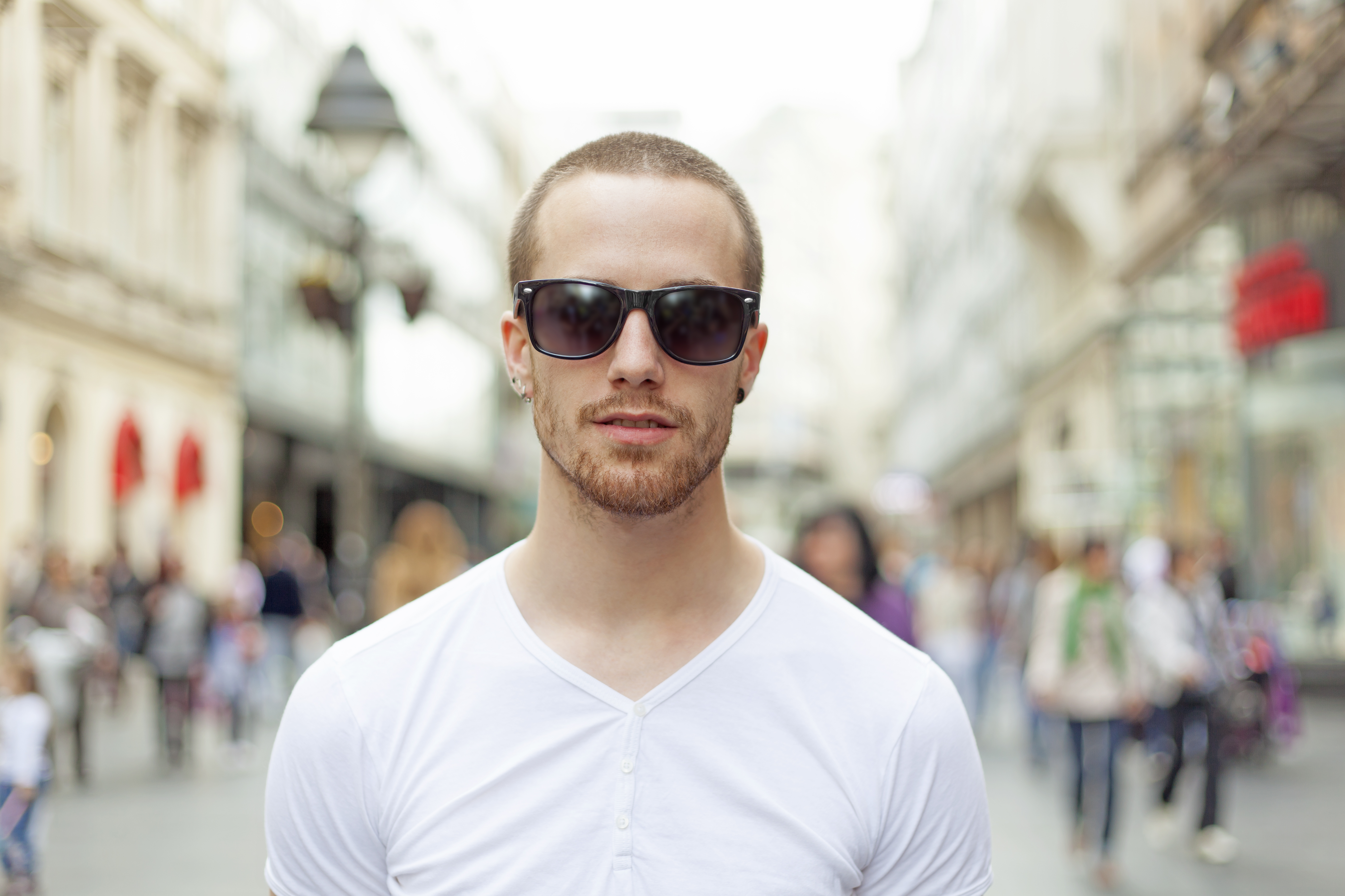 Man,In,White,Shirt,And,Dark,Eyeglasses,On,Street