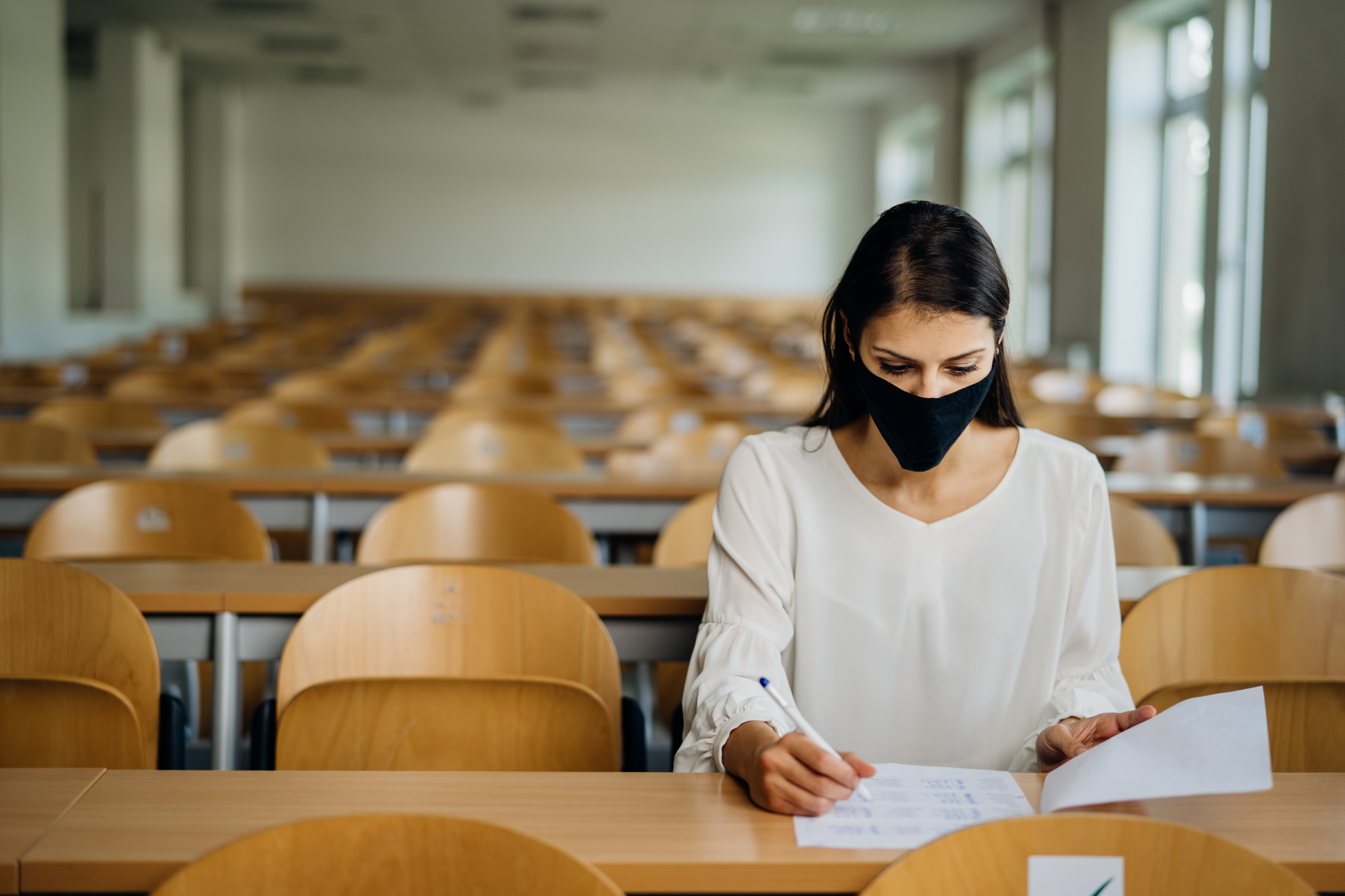 Female,Student,Taking,An,Exam,Wearing,A,Protective,Face,Mask