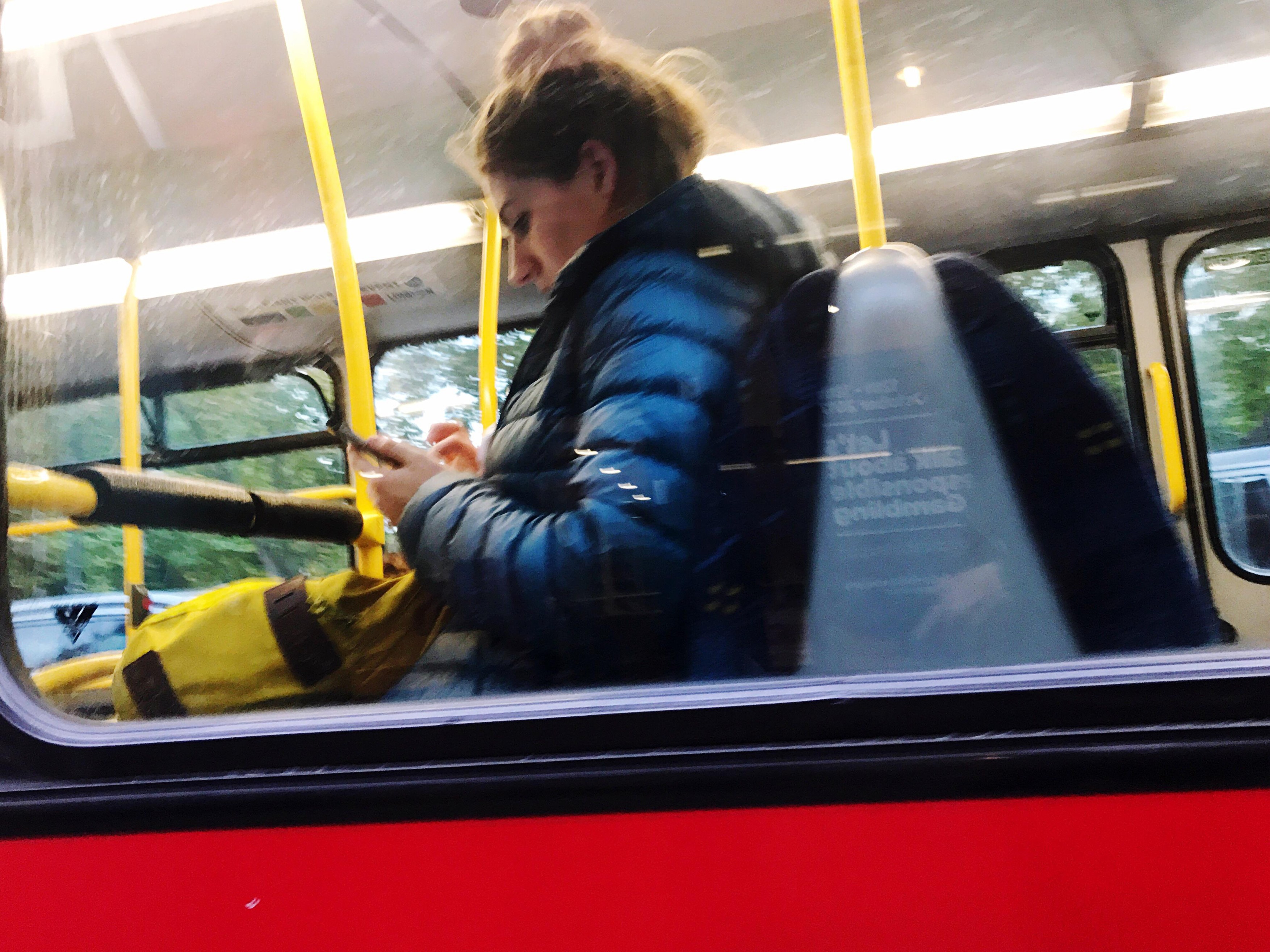 Woman on the phone in bus, London