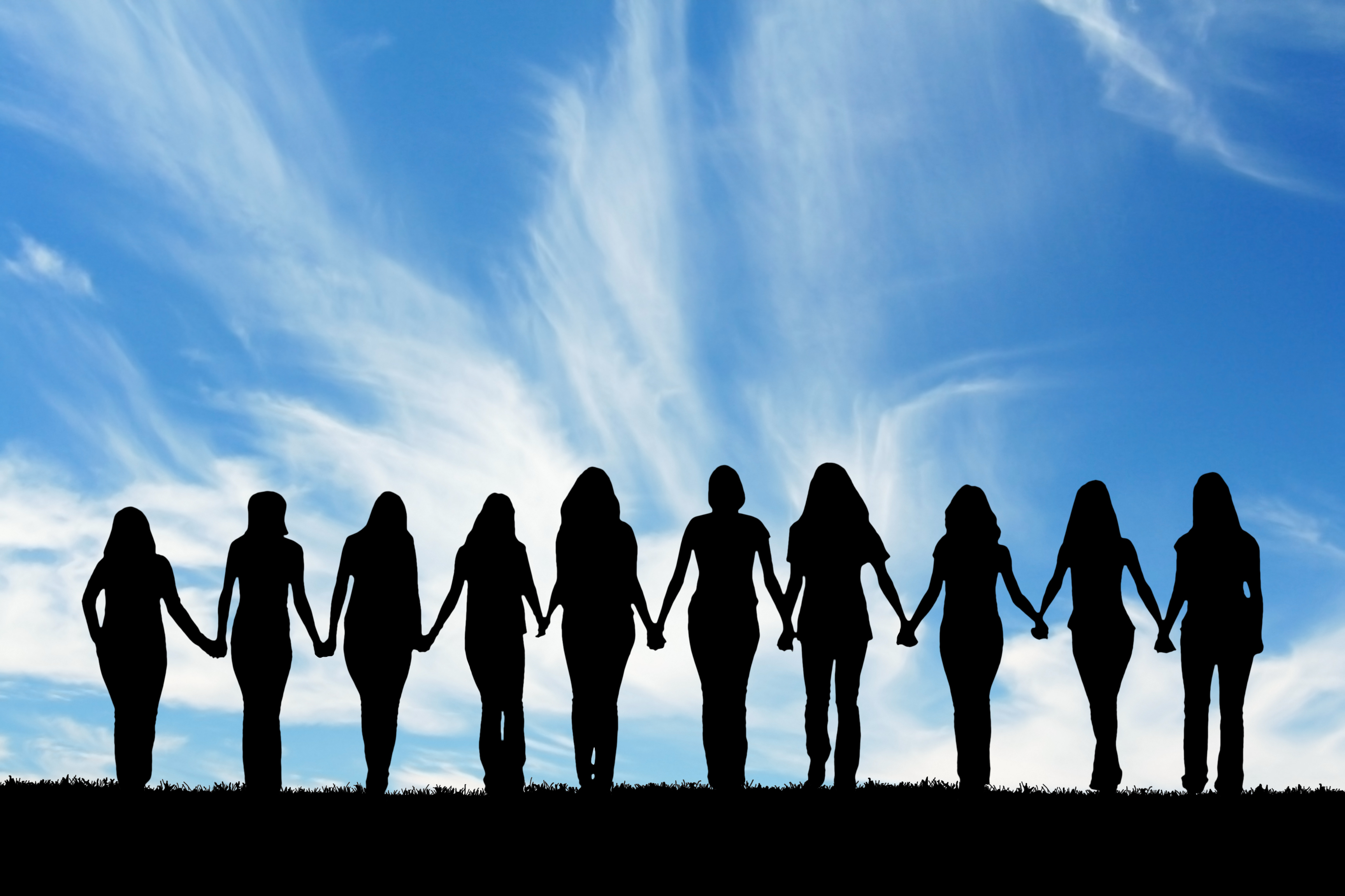 Silhouette,Of,Ten,Young,Women,,Walking,Hand,In,Hand.