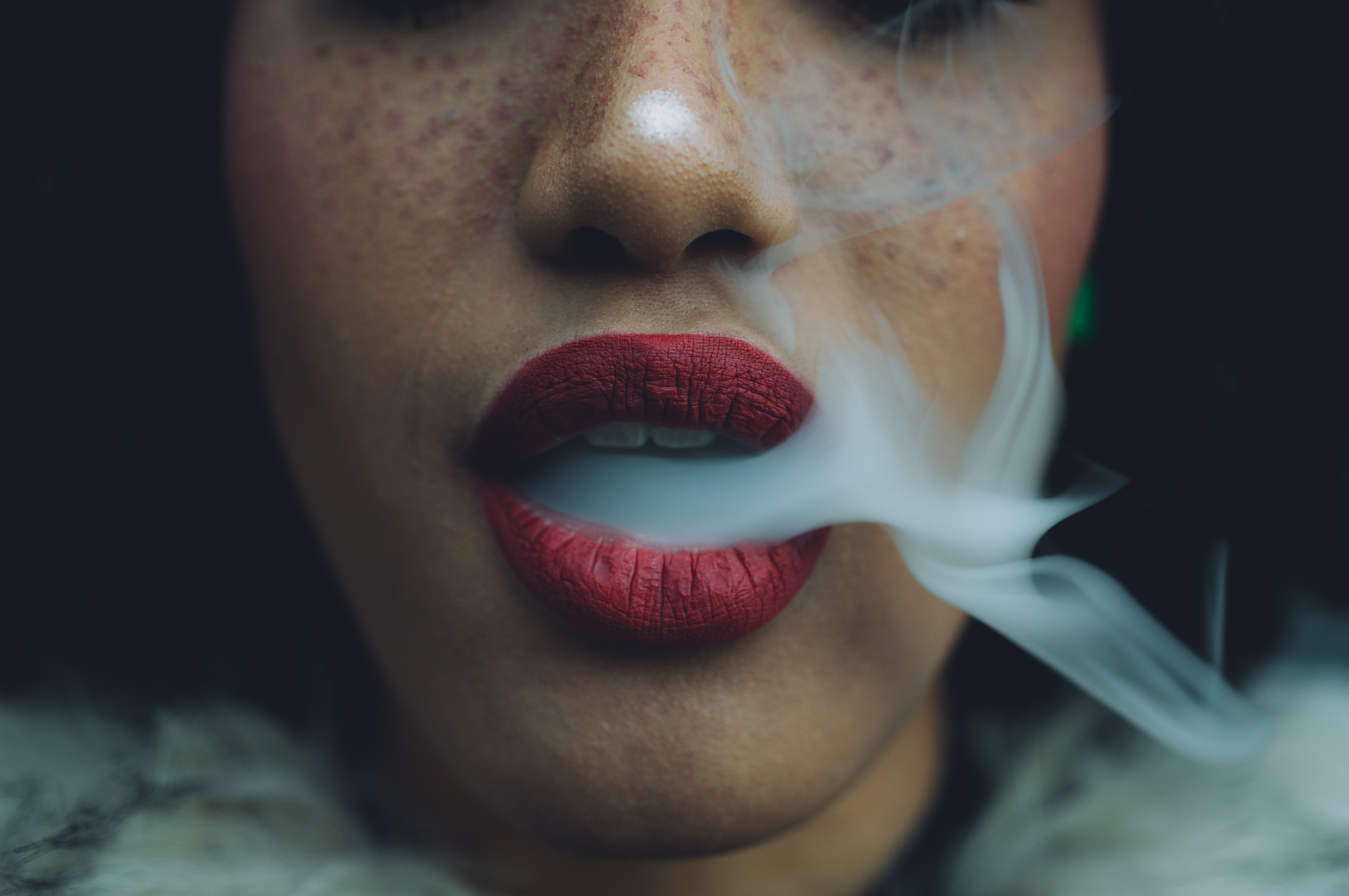 Woman,Smoking,,Close,Up,On,Smoke,And,Mouth