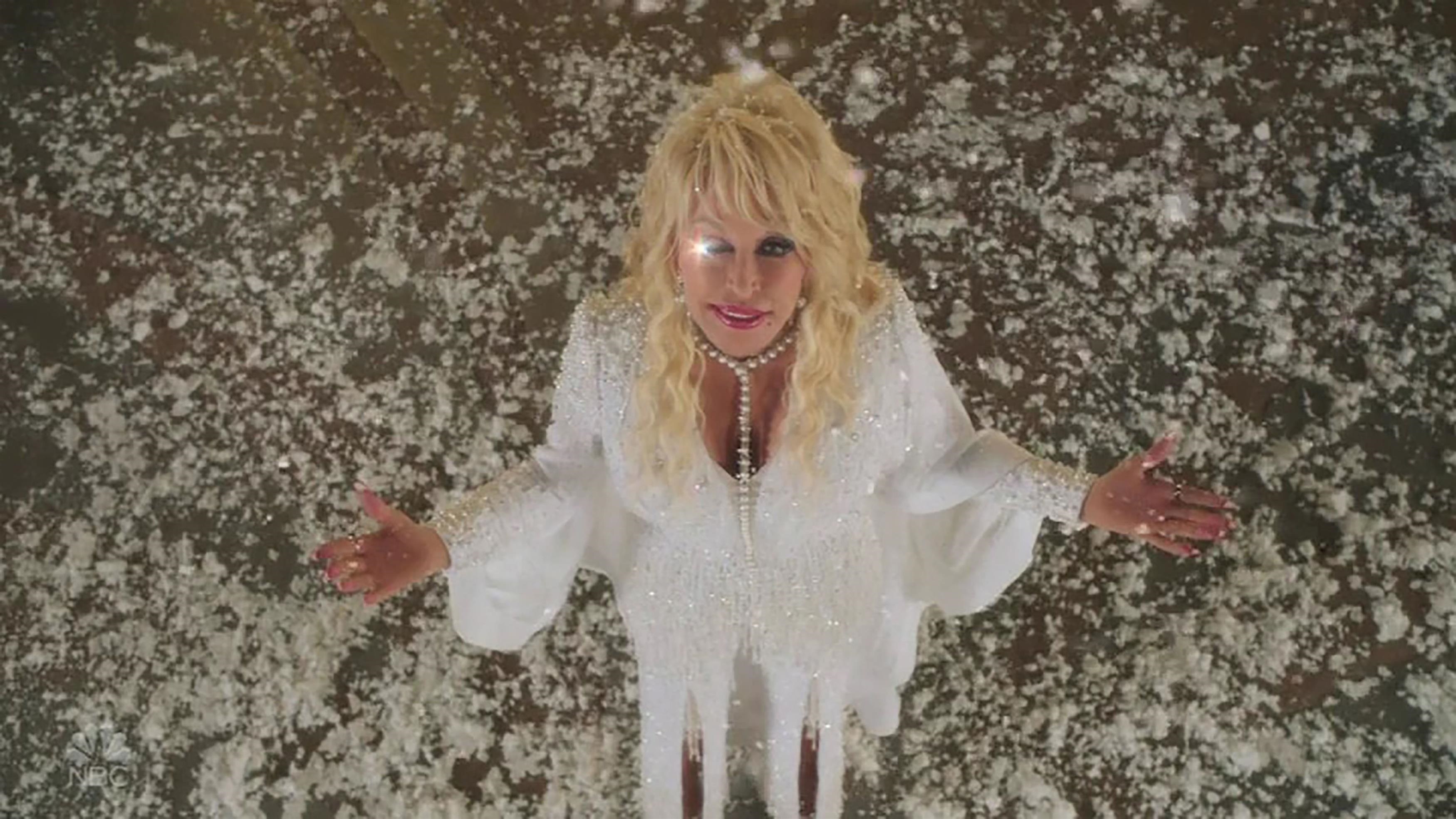 Dolly Parton gets into the festive spirit as she dresses as a sexy reindeer for her NBC Mountain Magic Christmas special