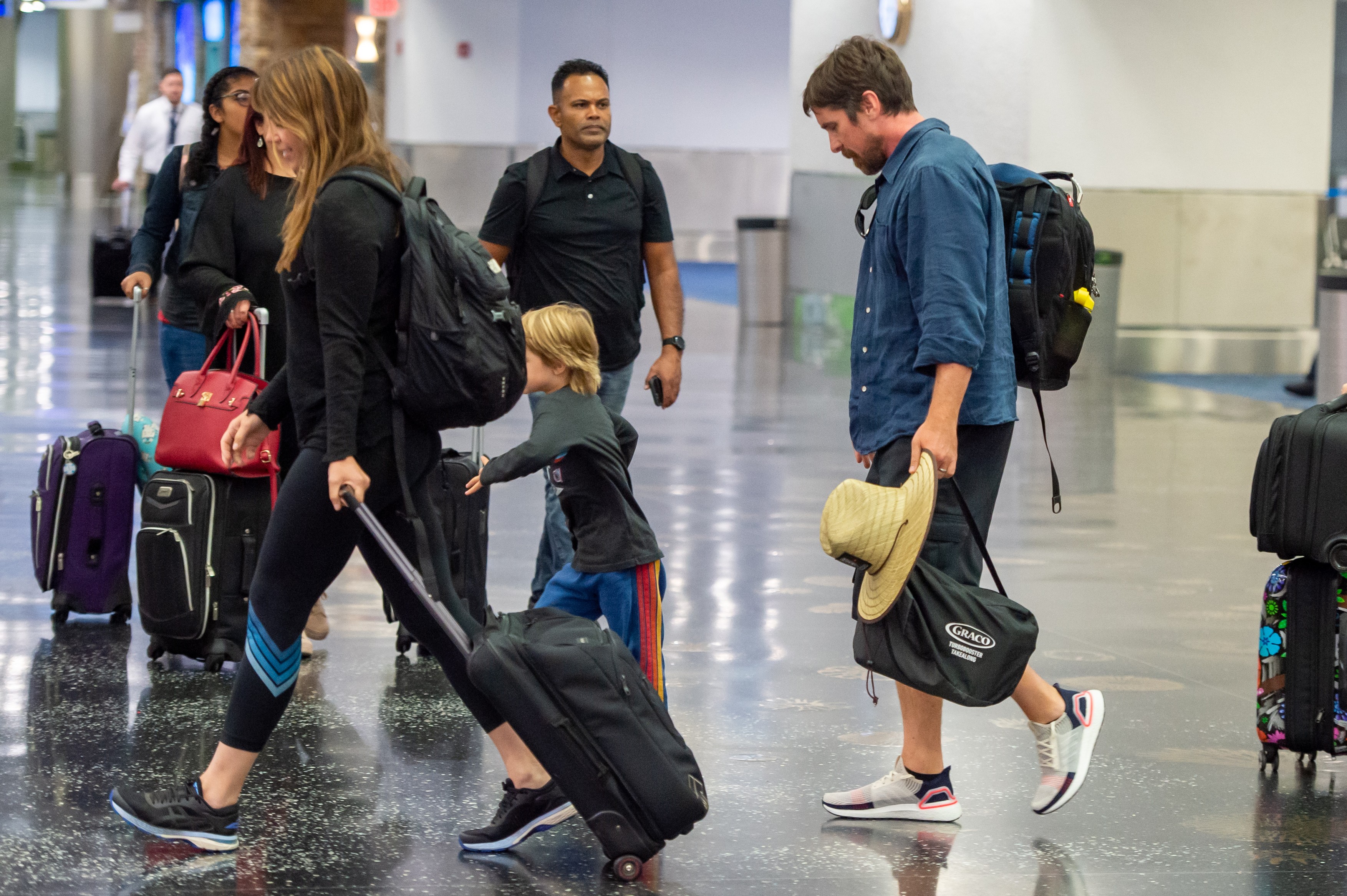 The Dark Knight Arrives For Some Sunshine! Christian Bale Is Seen Landing At Miami His Family