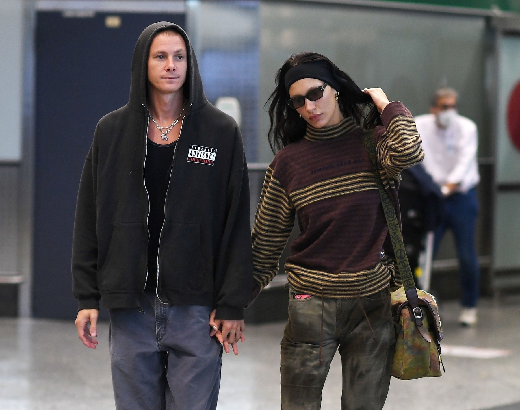 *EXCLUSIVE* The American Fashion Model Bella Hadid and her boyfriend  Marc Kalman show a public display of affection as they arrive in Milan for the Milan Fashion Week.