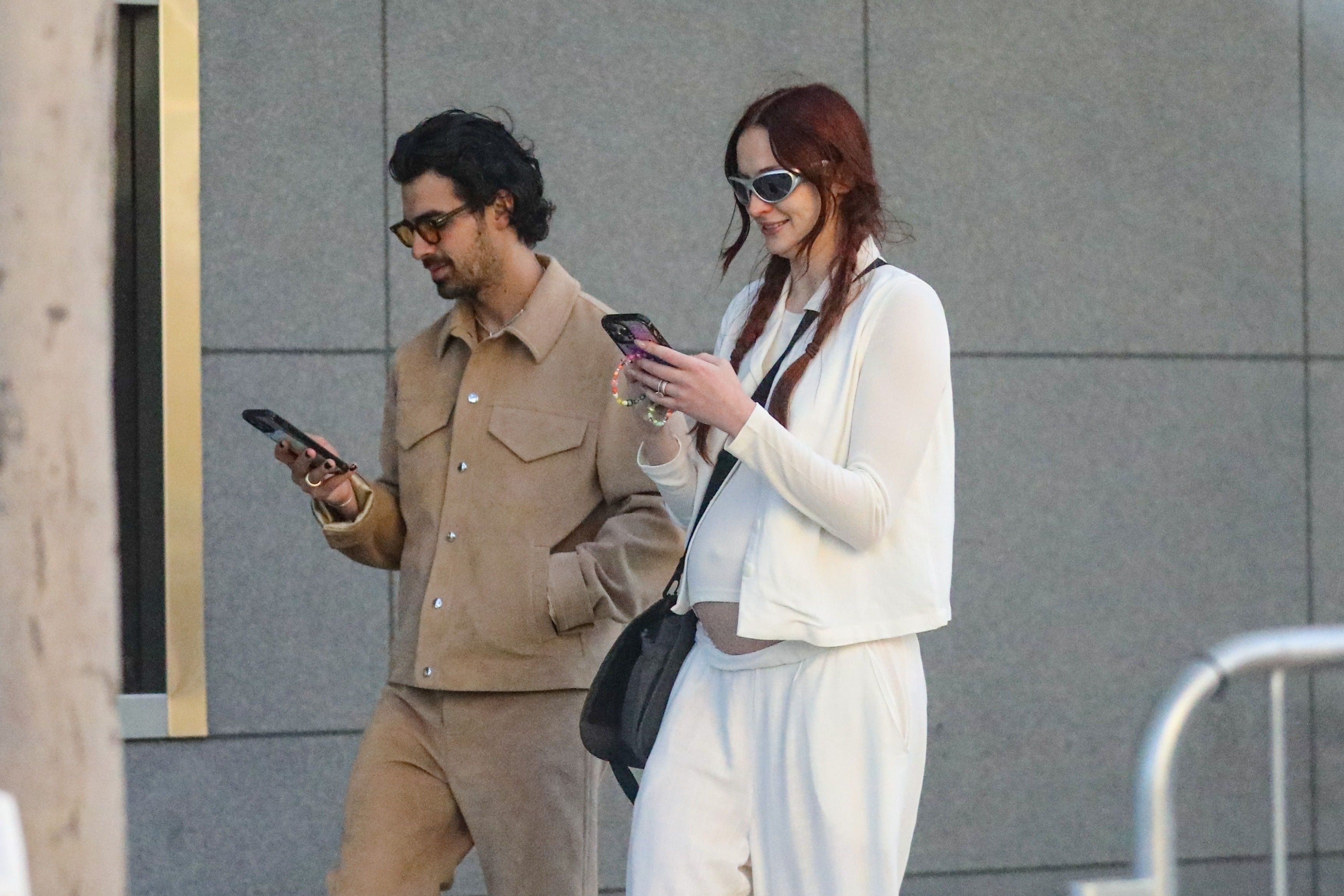 *EXCLUSIVE* Joe Jonas and pregnant wife Sophie Turner get glued to their phones while out shopping on Rodeo Dr.