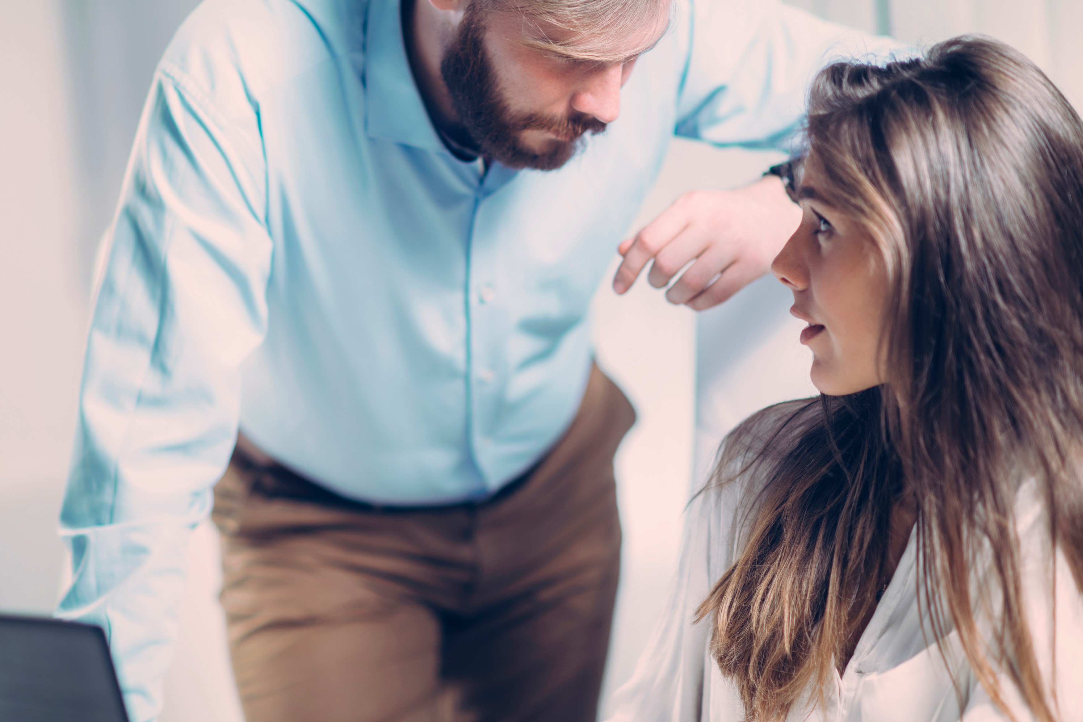 Businessman sexually harassing female colleague