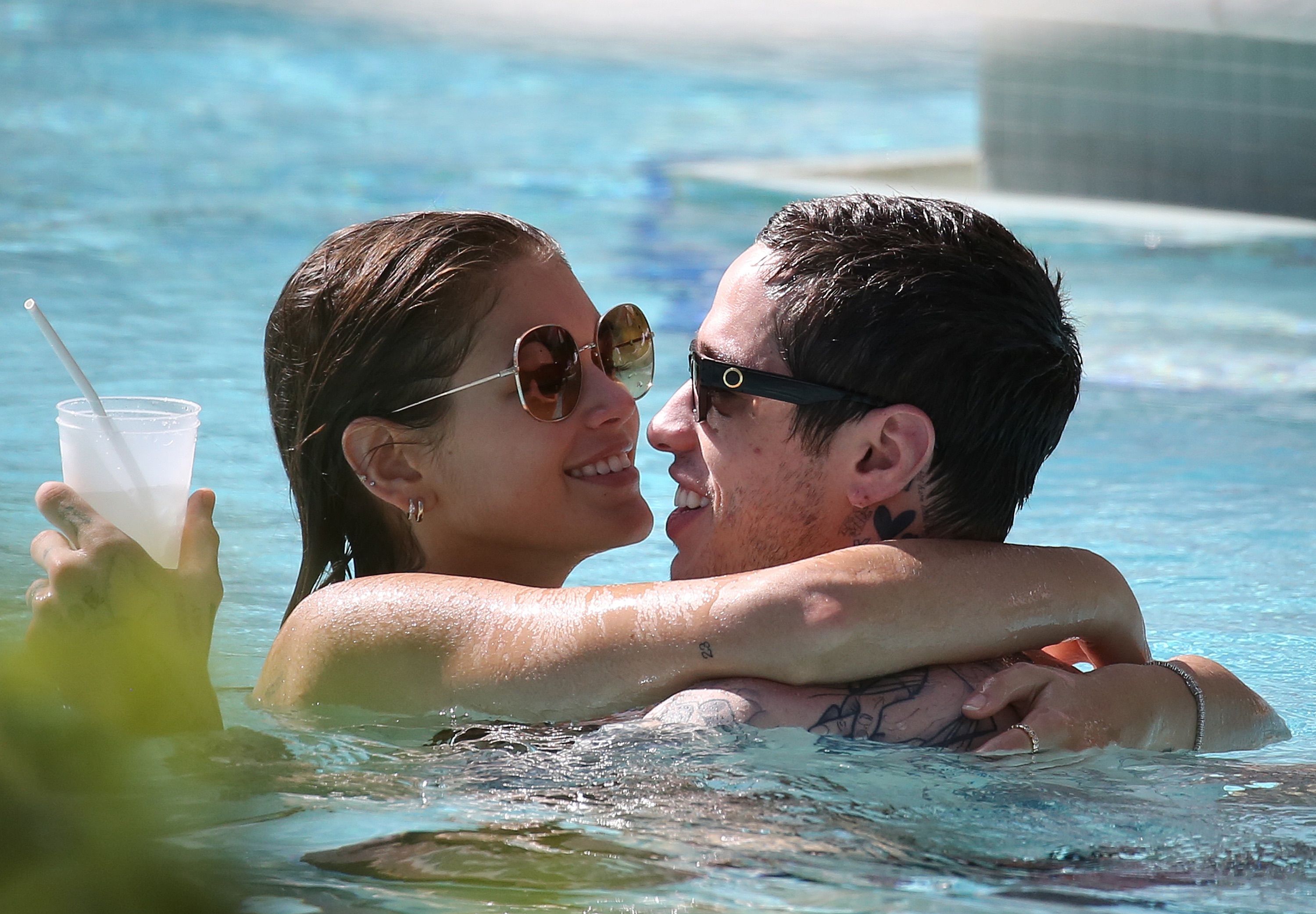 Kaia Gerber and boyfriend Pete Davidson can't stop kissing as they take a dip in the pool in Miami