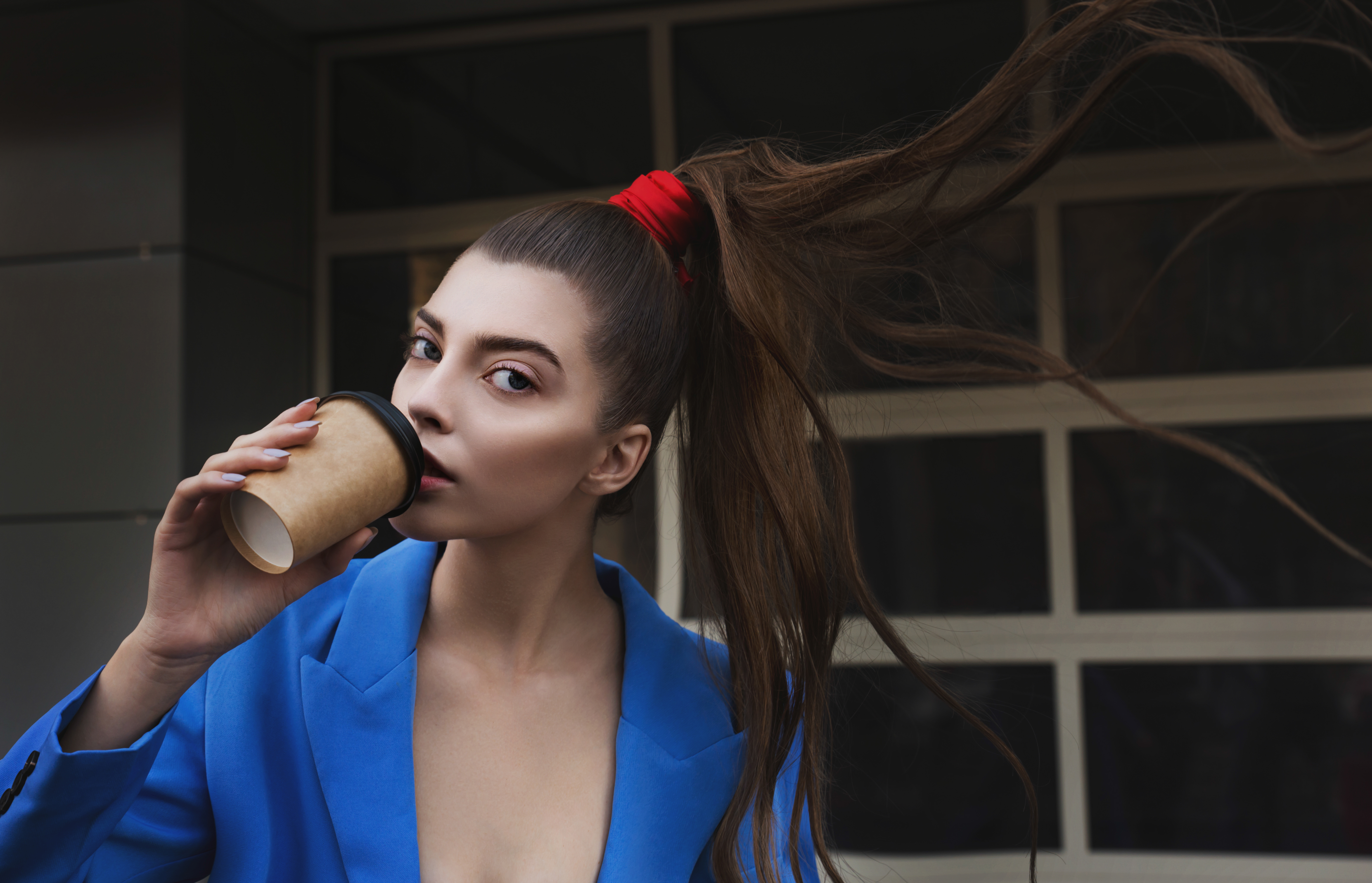 Beautiful,Young,Woman,In,A,Blue,Suit,With,A,Paper