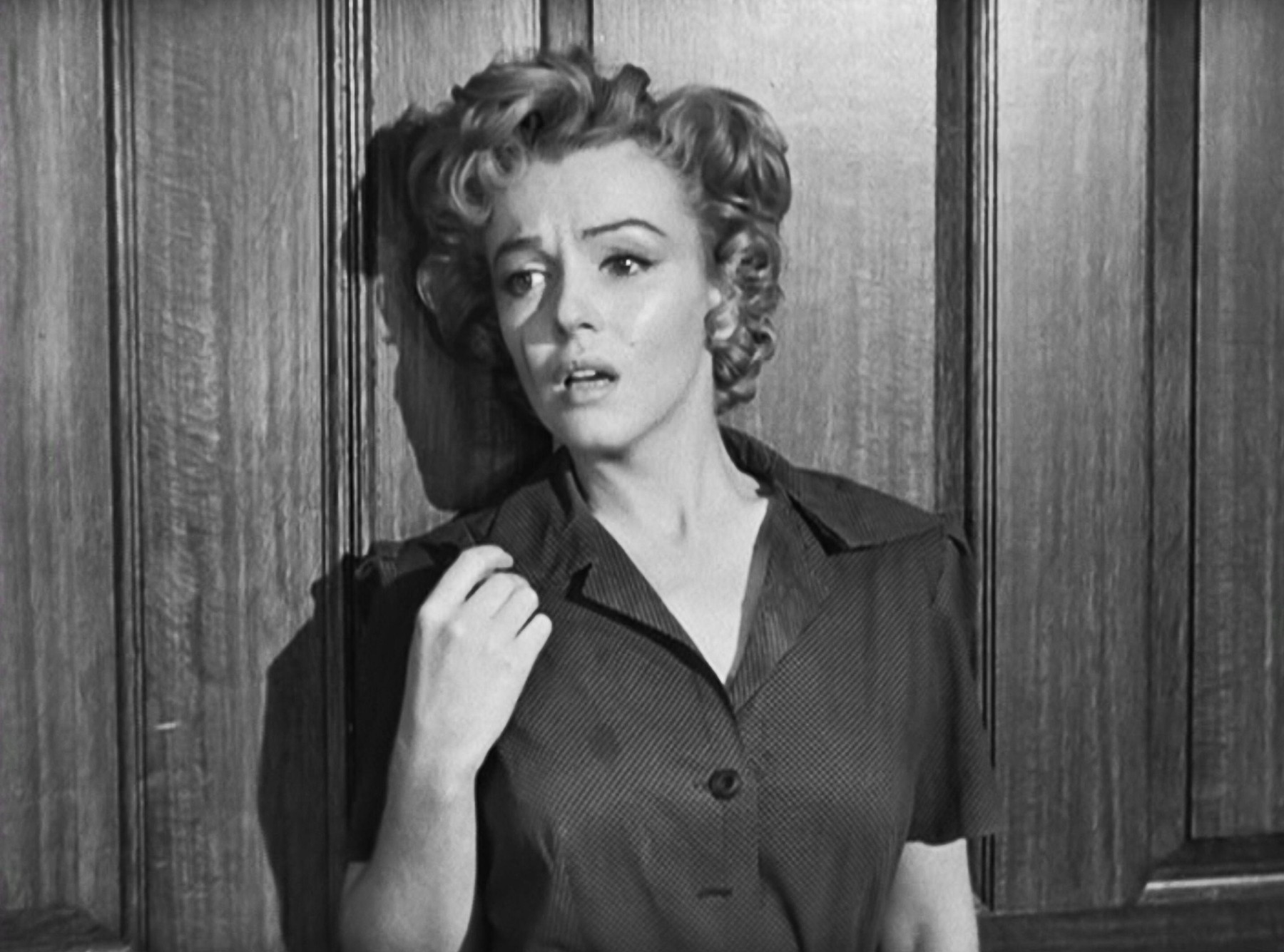 USA. Marilyn Monroe in a scene from the ©Twentieth Century Fox movie: Don't Bother to Knock (1952). Plot: After being dumped by his girlfriend, an airline pilot pursues a babysitter in his hotel and gradually realizes she's dangerous. Ref: LMK110-J6588-