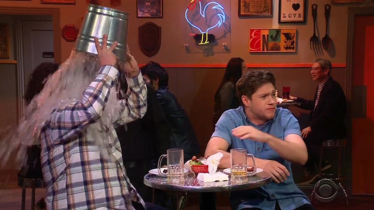 Niall Horan douses himself in ranch and blue cheese dressing as he faces off against James Corden in hilarious Late Late Show hot wings skit