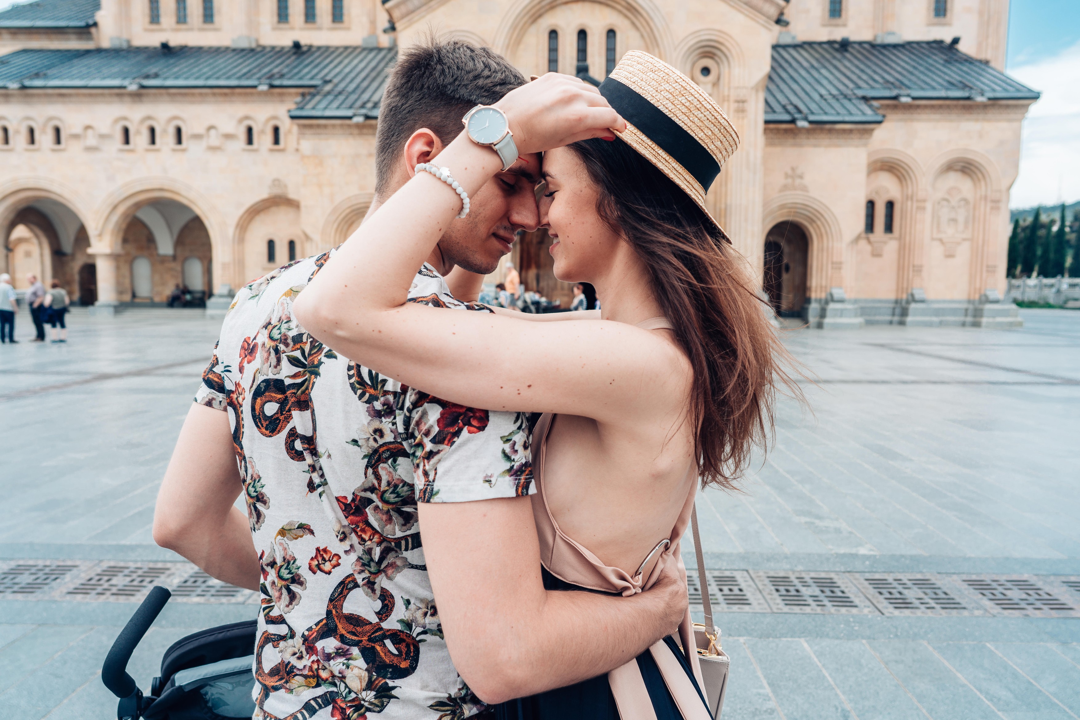 Young couple in love, hugging on the street.