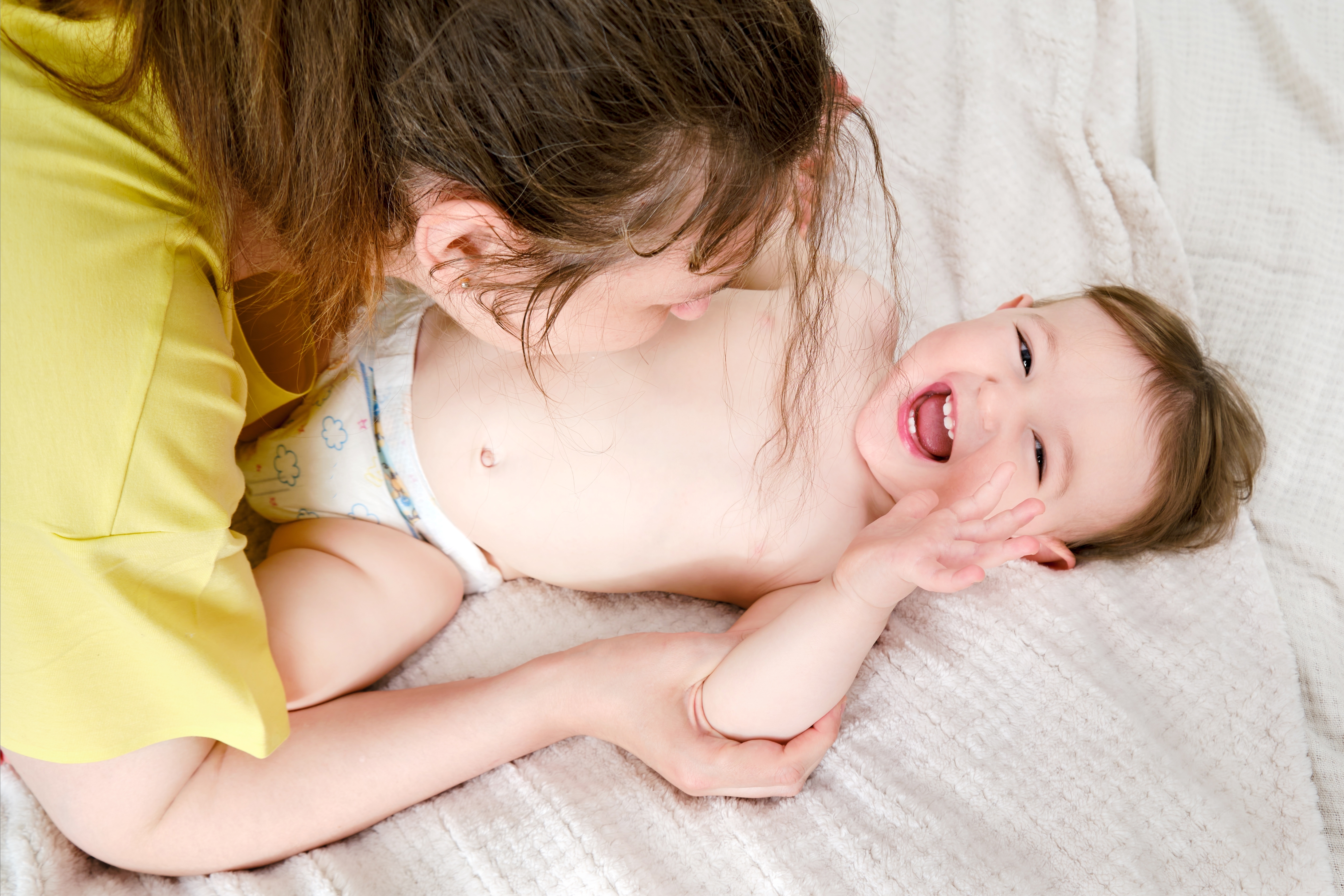 Mother,Kisses,Happy,Toddler,Baby,Boy,On,Home,Bed.,Kid