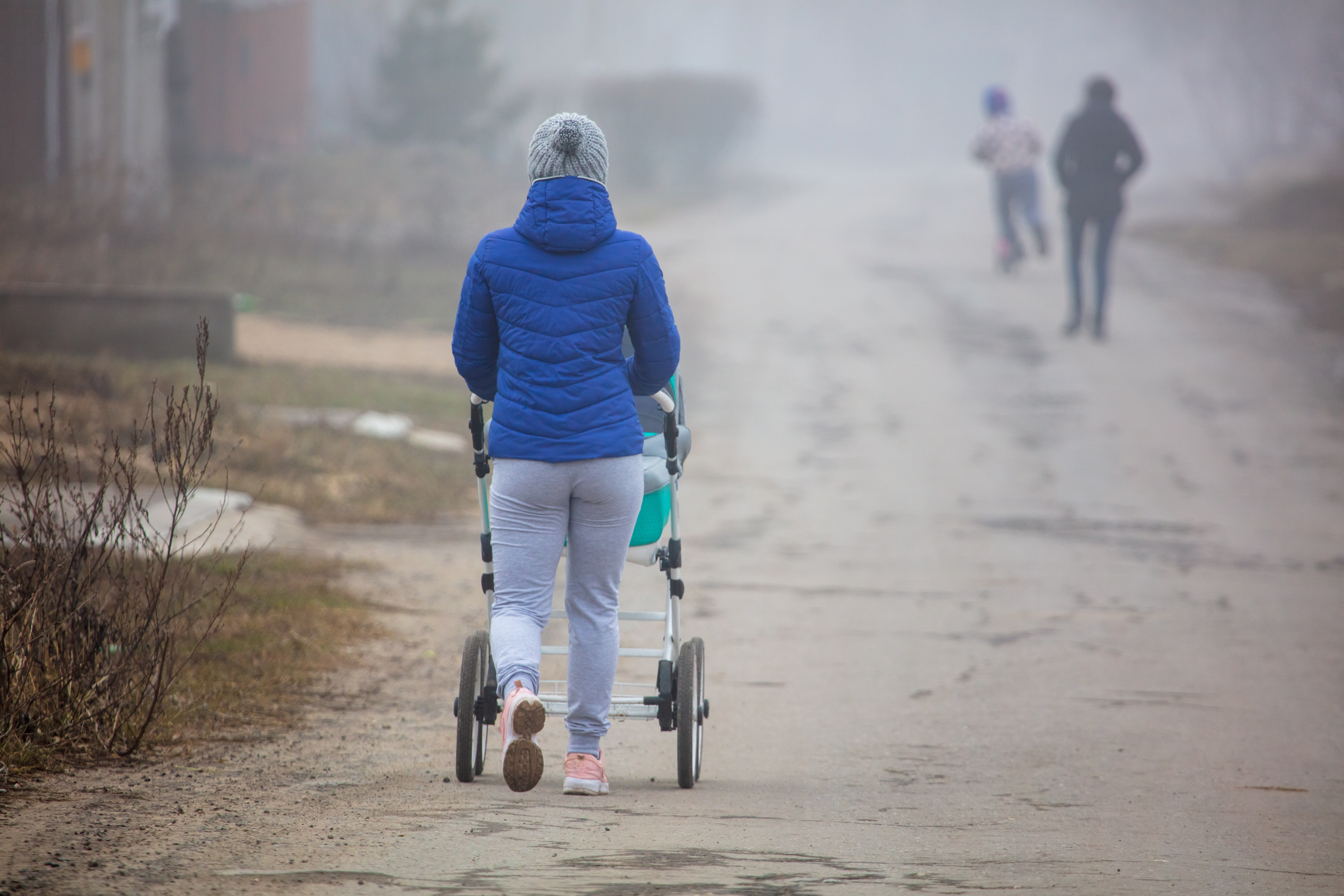 A,Girl,With,A,Stroller,Goes,On,The,Road,To