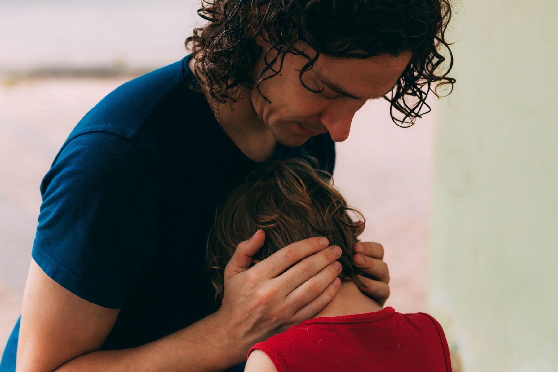 Father's Day. Dad with his little son. Family walk with a child. Outdoor activities for family. Dad snuggles up to son on the street. Family relations