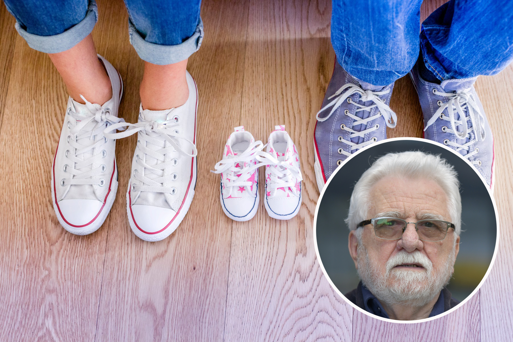 Cropped view of baby shoes between man and woman's feet