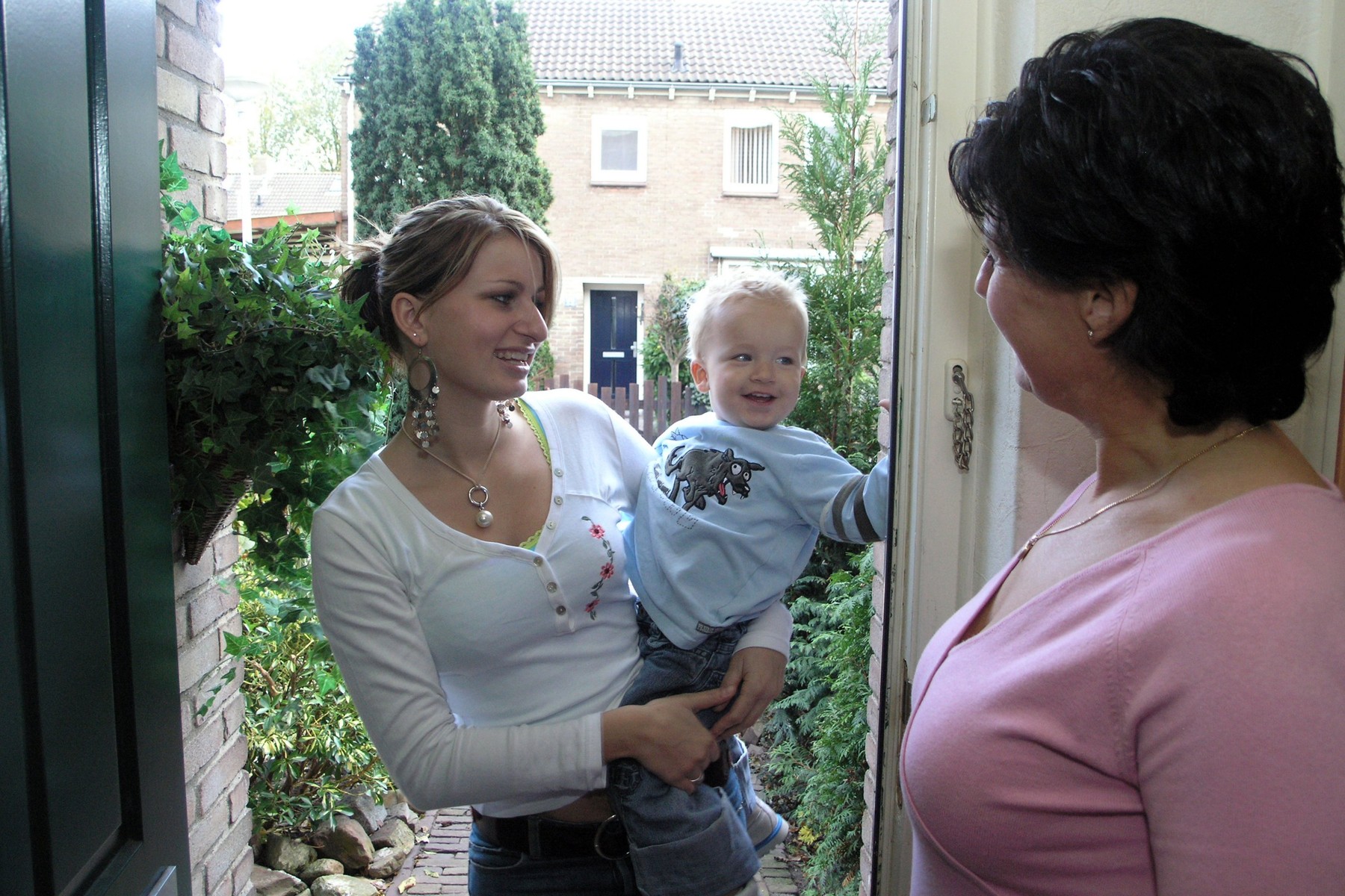 Grown up daughter visiting her mother in law on mothers day