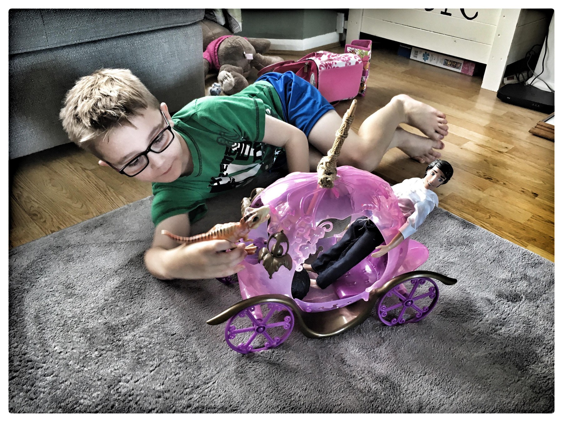 6 year old boy playing with Barbie Stage coach.