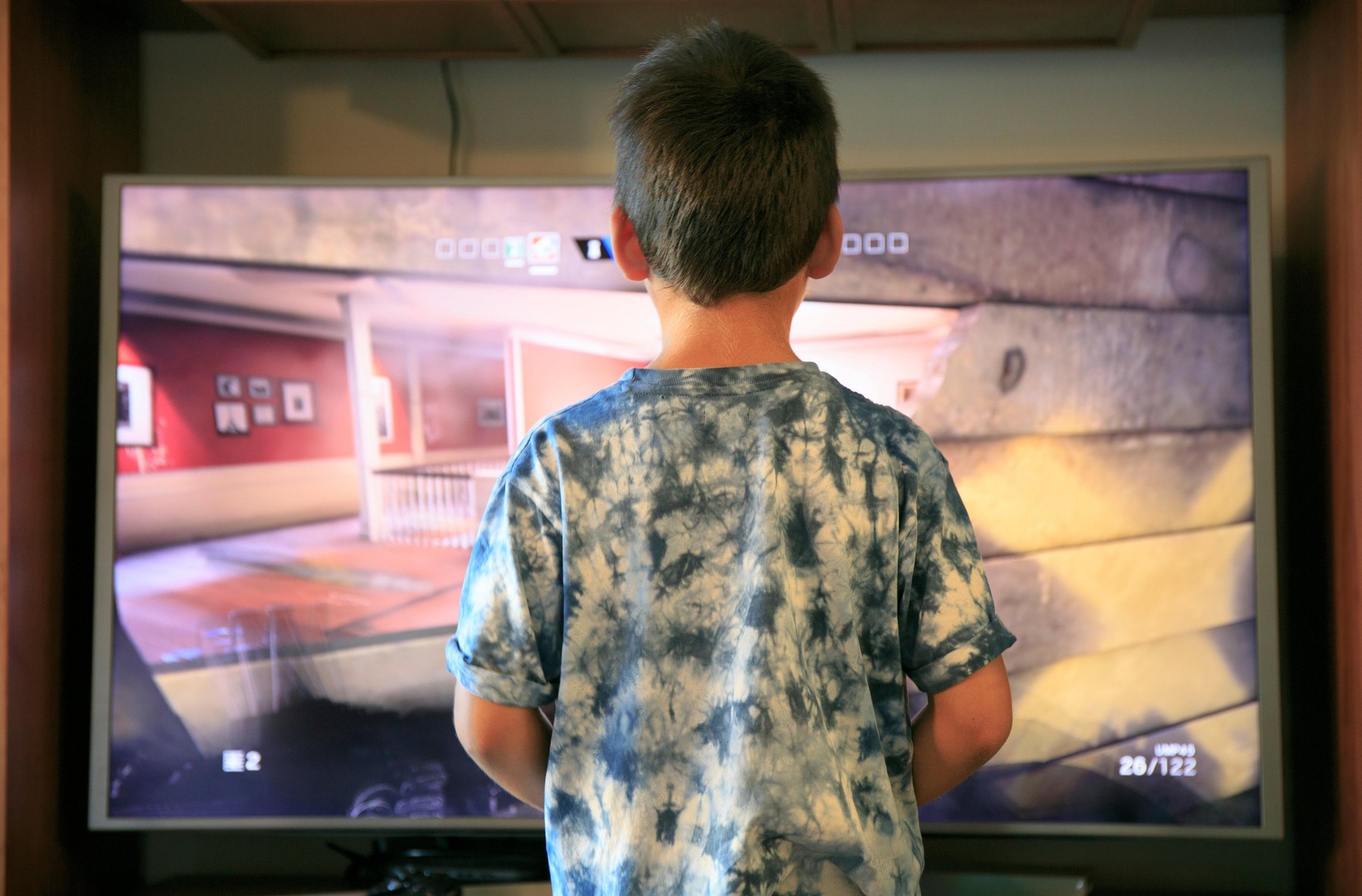 boy playing video game console