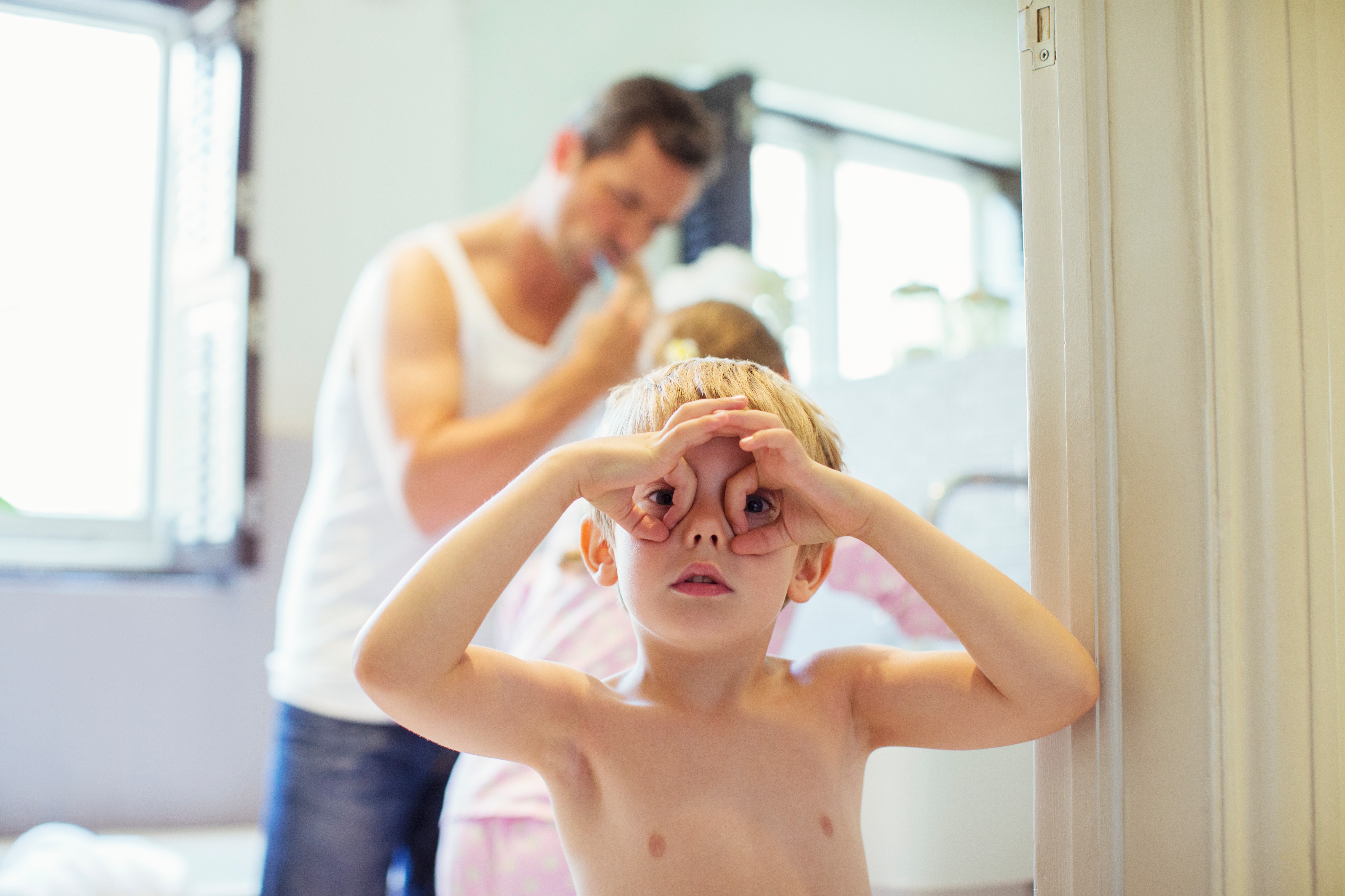 Boy making face in bathroom