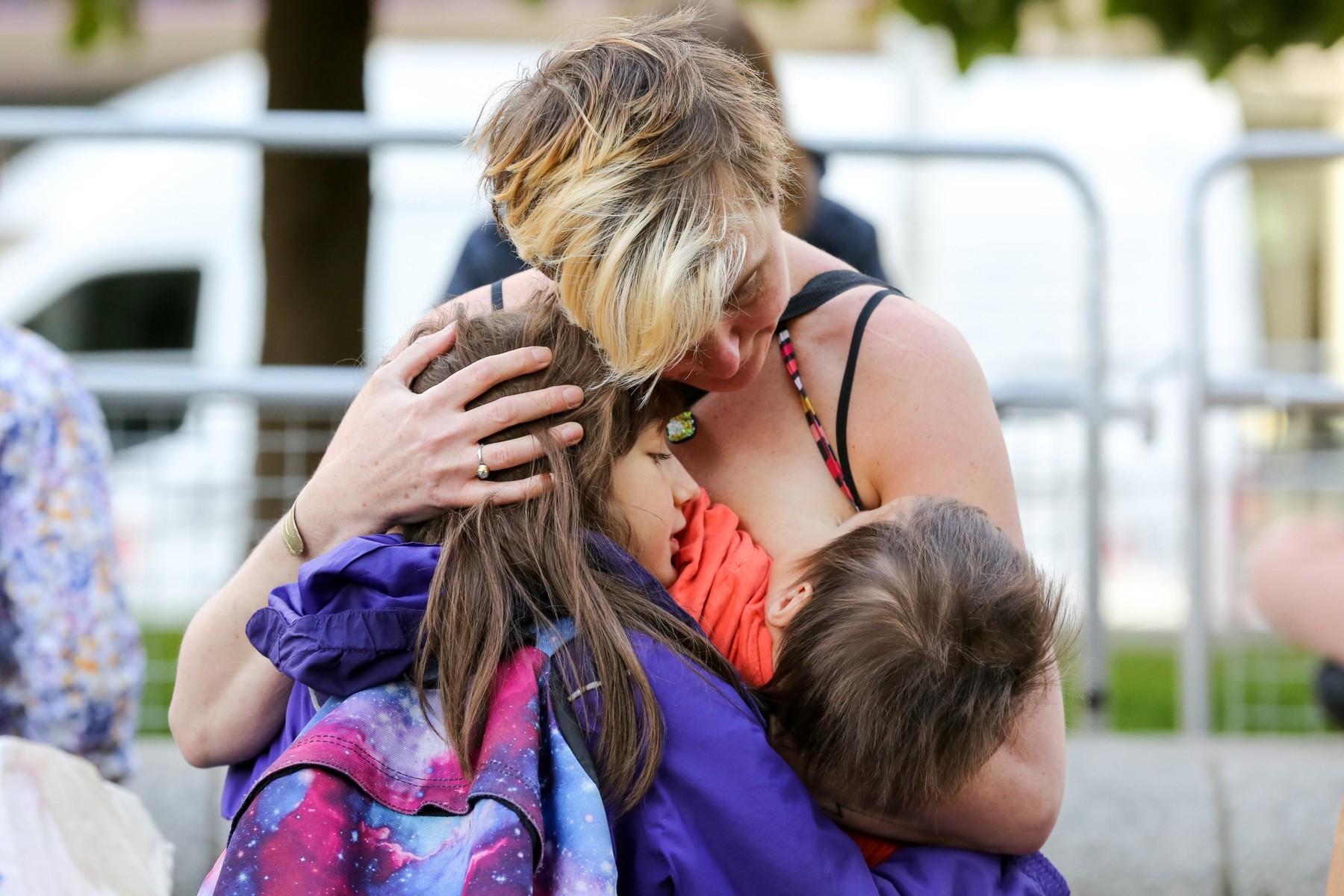 A mother from the Extinction Rebellion movement breastfeeds her baby while holding a child in Westminster on day three of the Climate Change protest.The activists are calling on government departments to 'Tell the Truth' about what they are doing to tackl