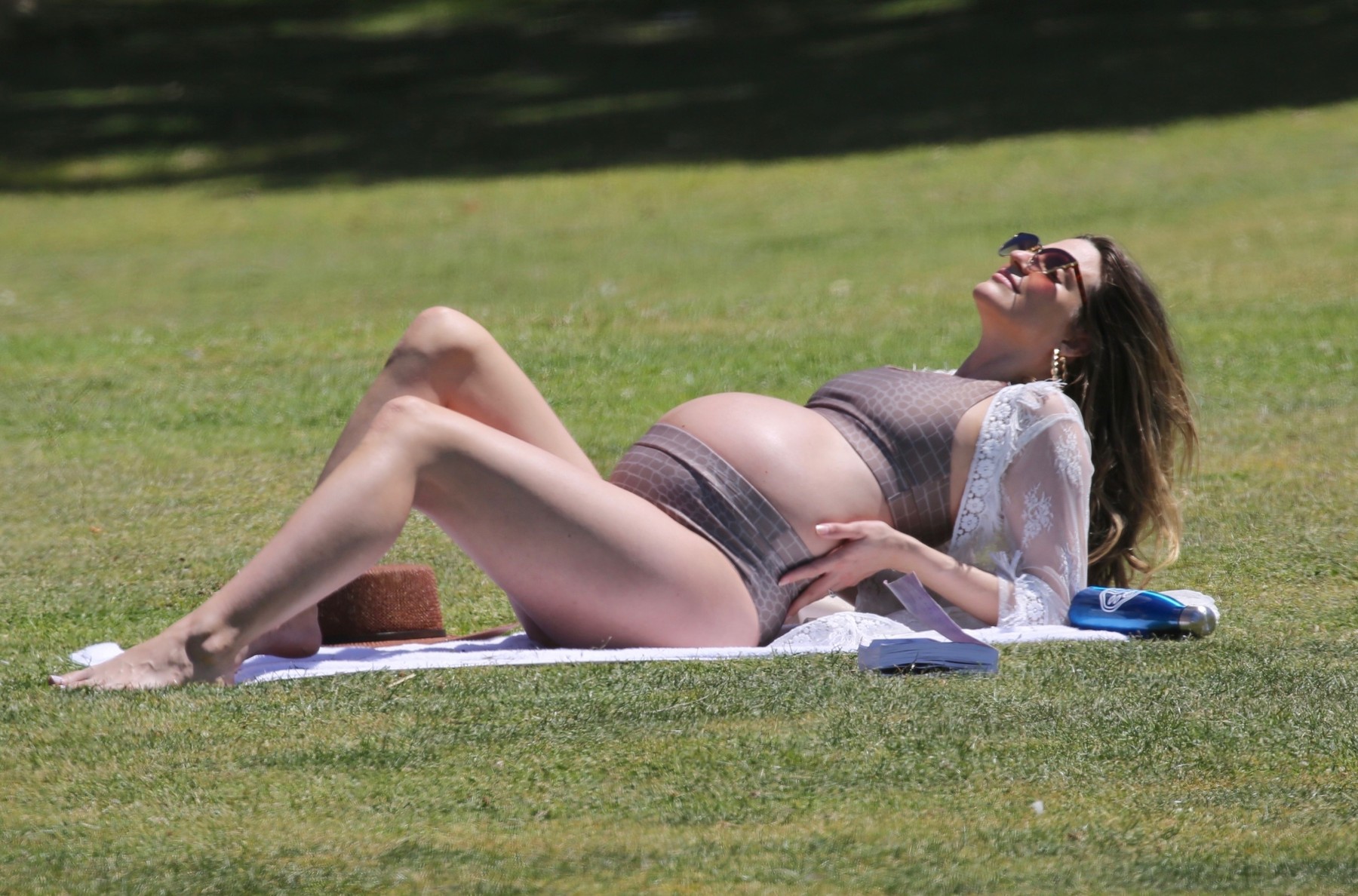 *EXCLUSIVE* A heavily pregnant Rachel McCord displays her growing baby bump wearing a two-piece