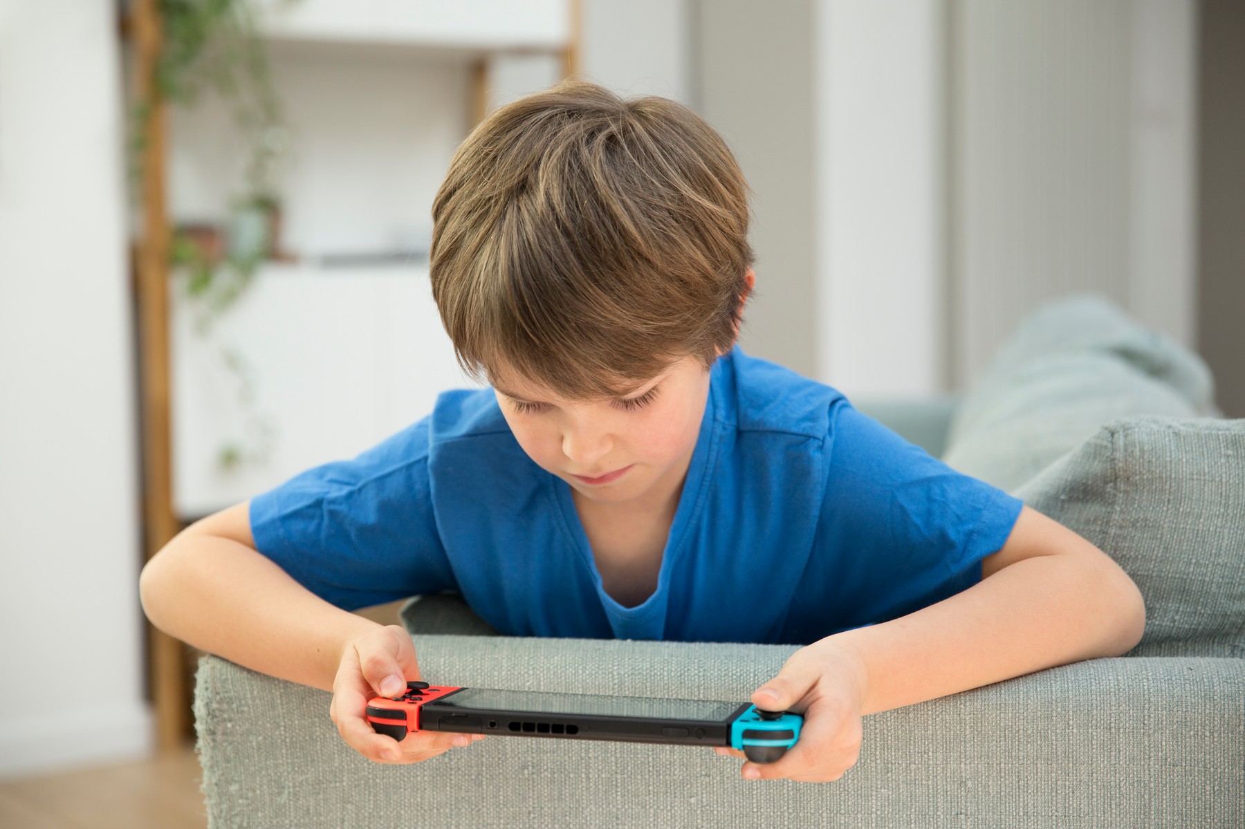 CHILD PLAYING VIDEO GAME