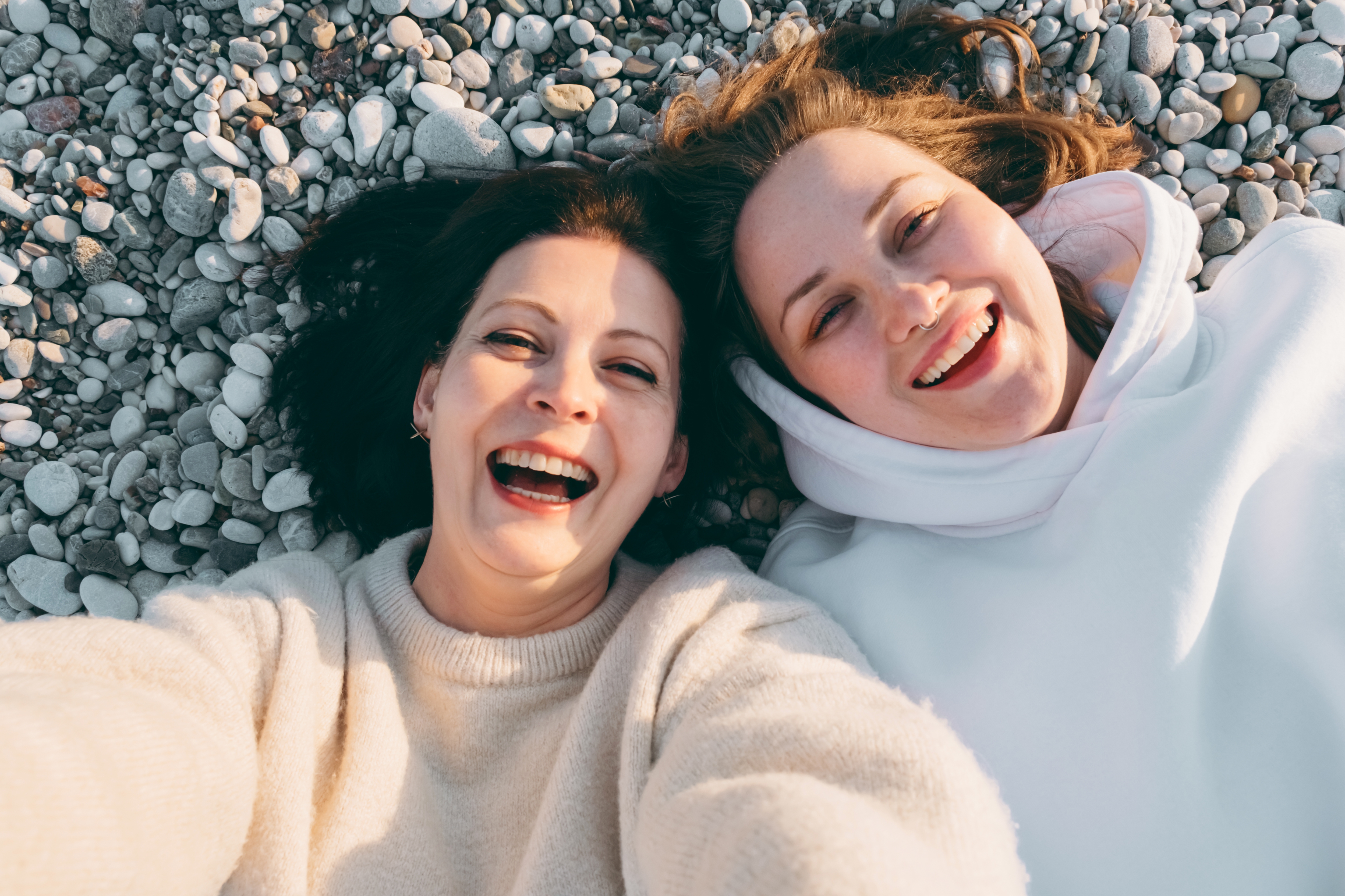 Girls,On,The,Beach.,Charming,Couple,Of,Girlfriends,Lying,On