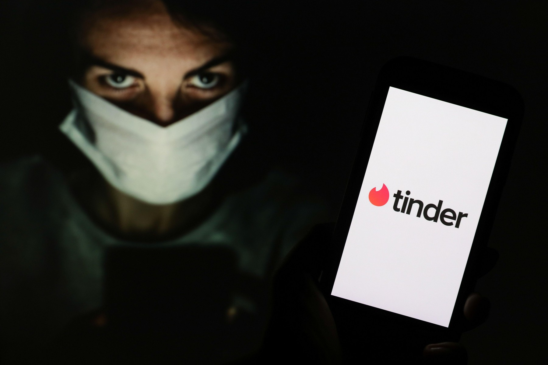 In this photo illustration a Tinder dating app logo seen displayed on a smartphone.